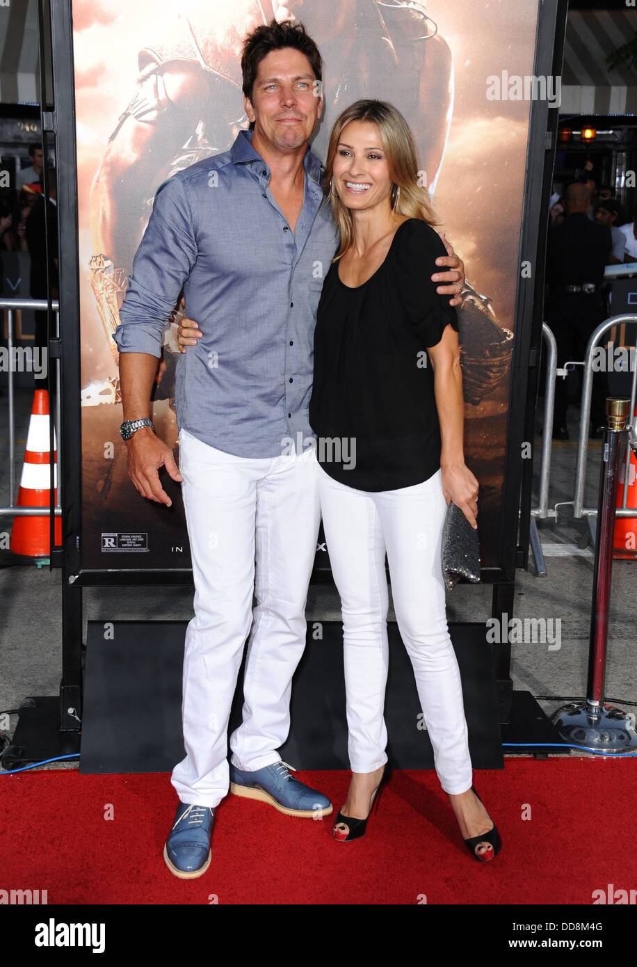 Los Angeles, CA. 28th Aug, 2013. Michael Trucco, Sandra Hess at arrivals for RIDDICK Premiere, Regency Village Theatre in Westwood, Los Angeles, CA August 28, 2013. Credit:  Dee Cercone/Everett Collection/Alamy Live News Stock Photo