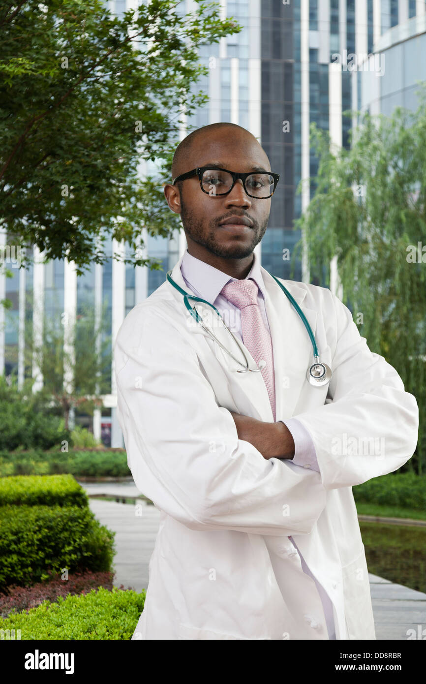 Black doctor standing in urban park Stock Photo - Alamy