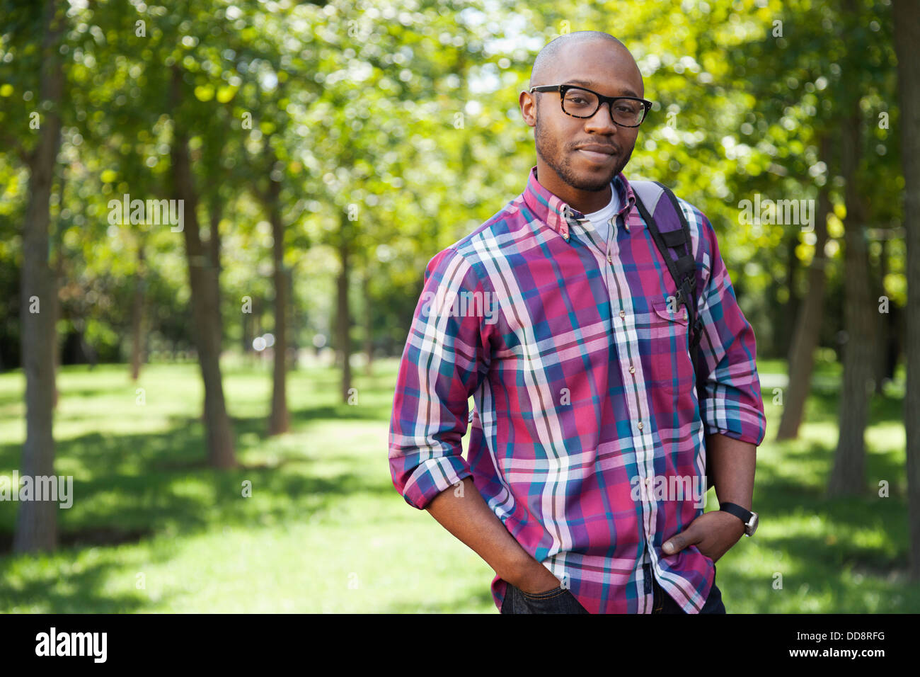 Black man smiling in park Stock Photo