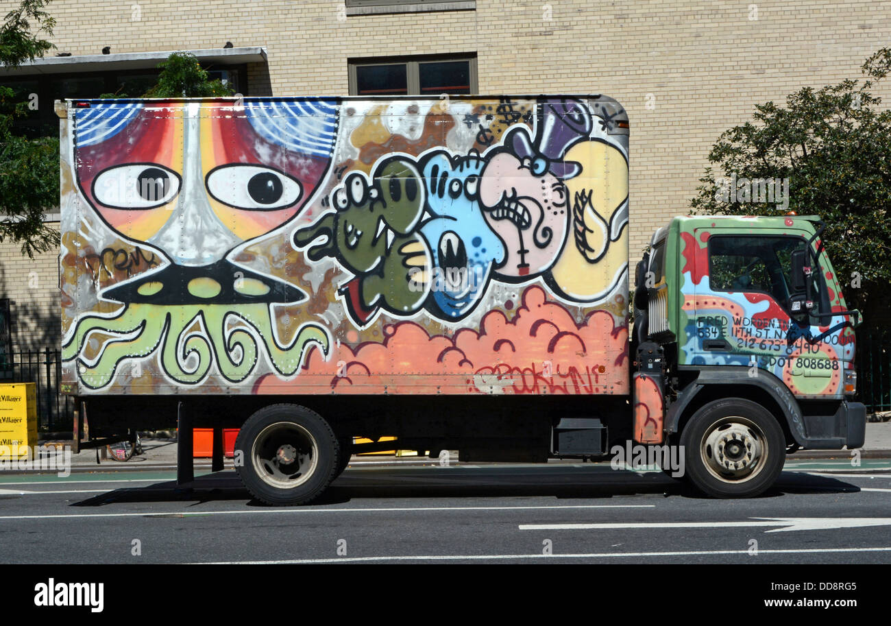 A truck with painted graffiti parked on First avenue in the East Village, New York City Stock Photo