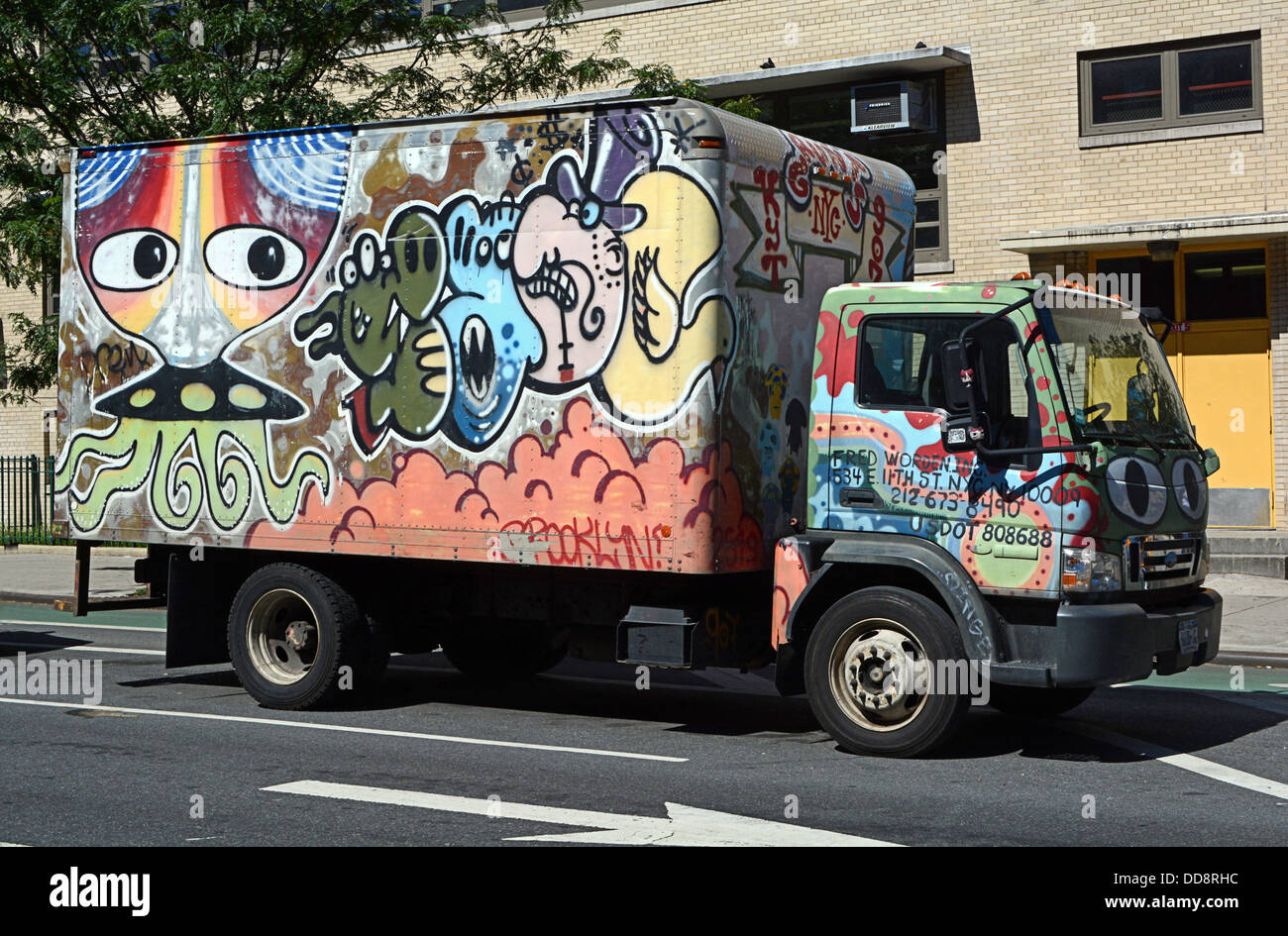 A truck with painted graffiti parked on First avenue in the East Village, New York City Stock Photo