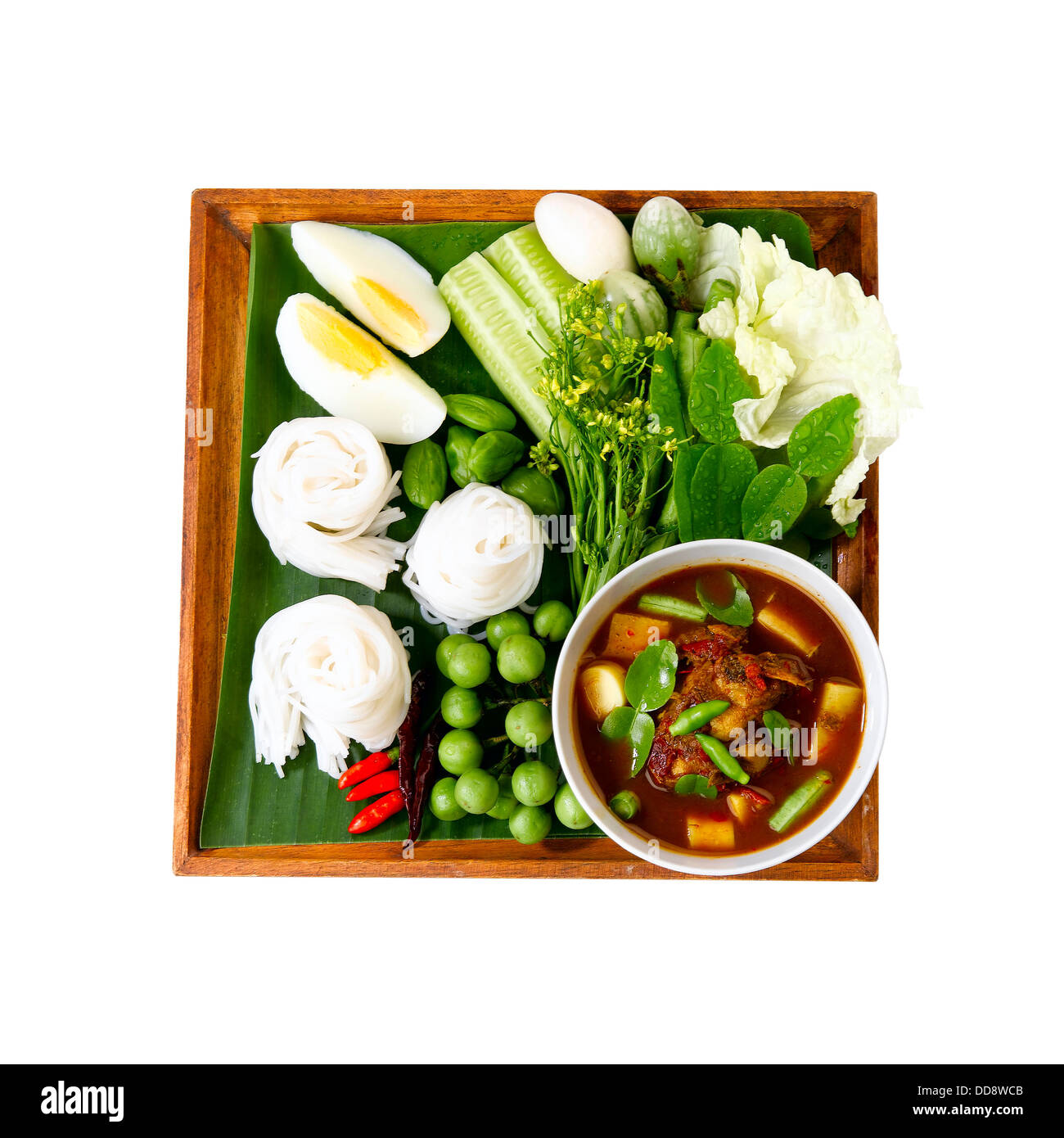 Thai noodle known as "kha nom jean" and very spicy curry known as "tai pla curry" the popular of southern food in Thailand Stock Photo