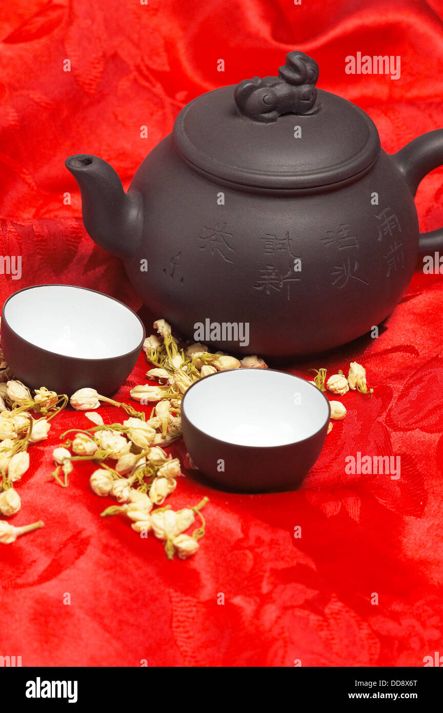jasmine tea over red silk Stock Photo Alamy