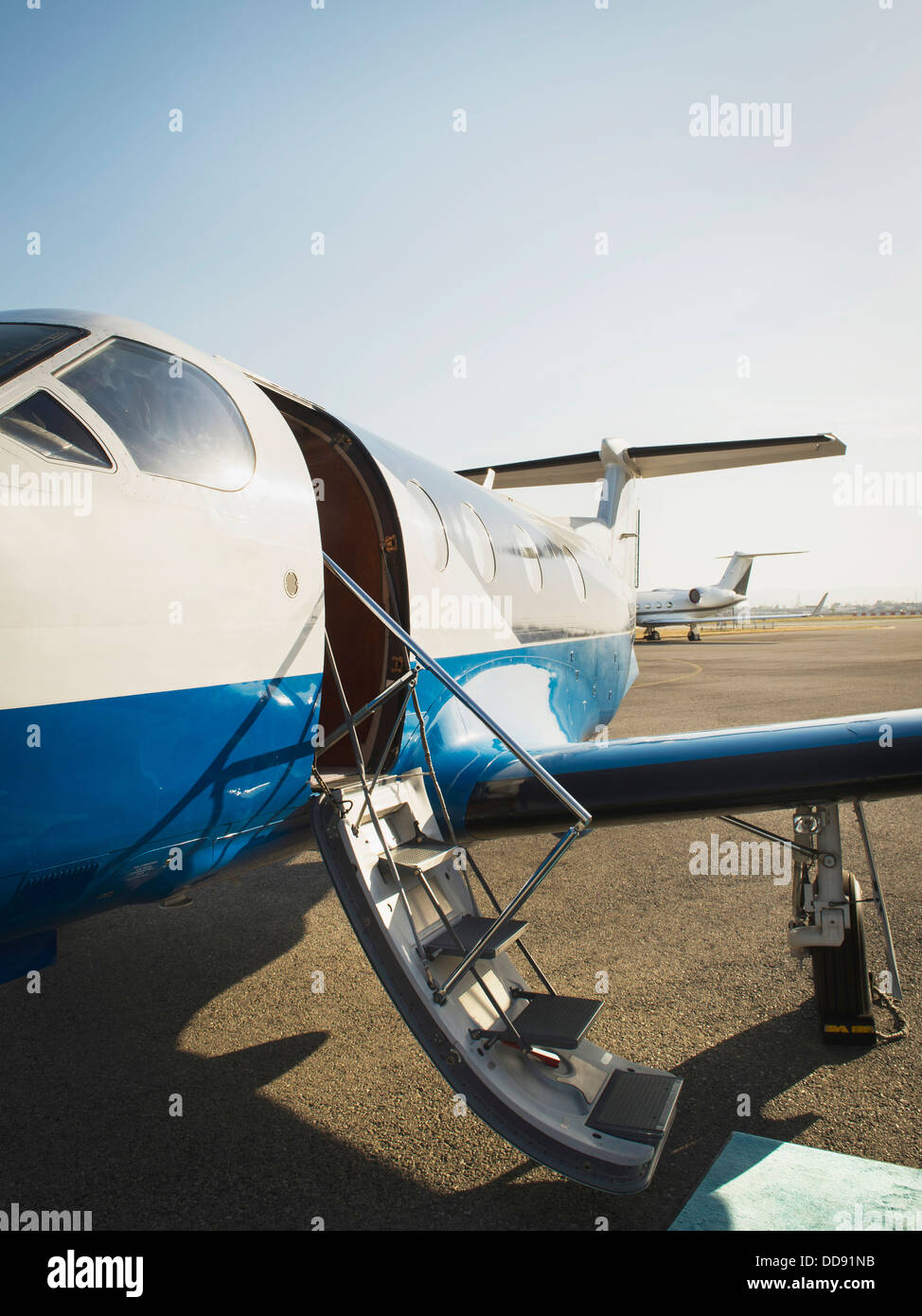 Airplane grounded on runway Stock Photo