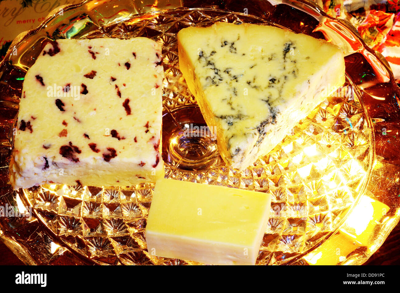 Blue Stilton, Wensleydale with cranberries and Cheddar cheeses on a glass plate. Stock Photo