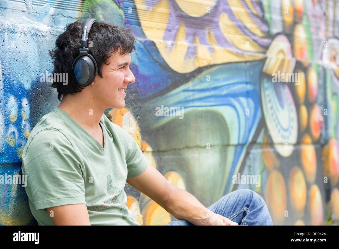 Hispanic man listening to headphones Stock Photo
