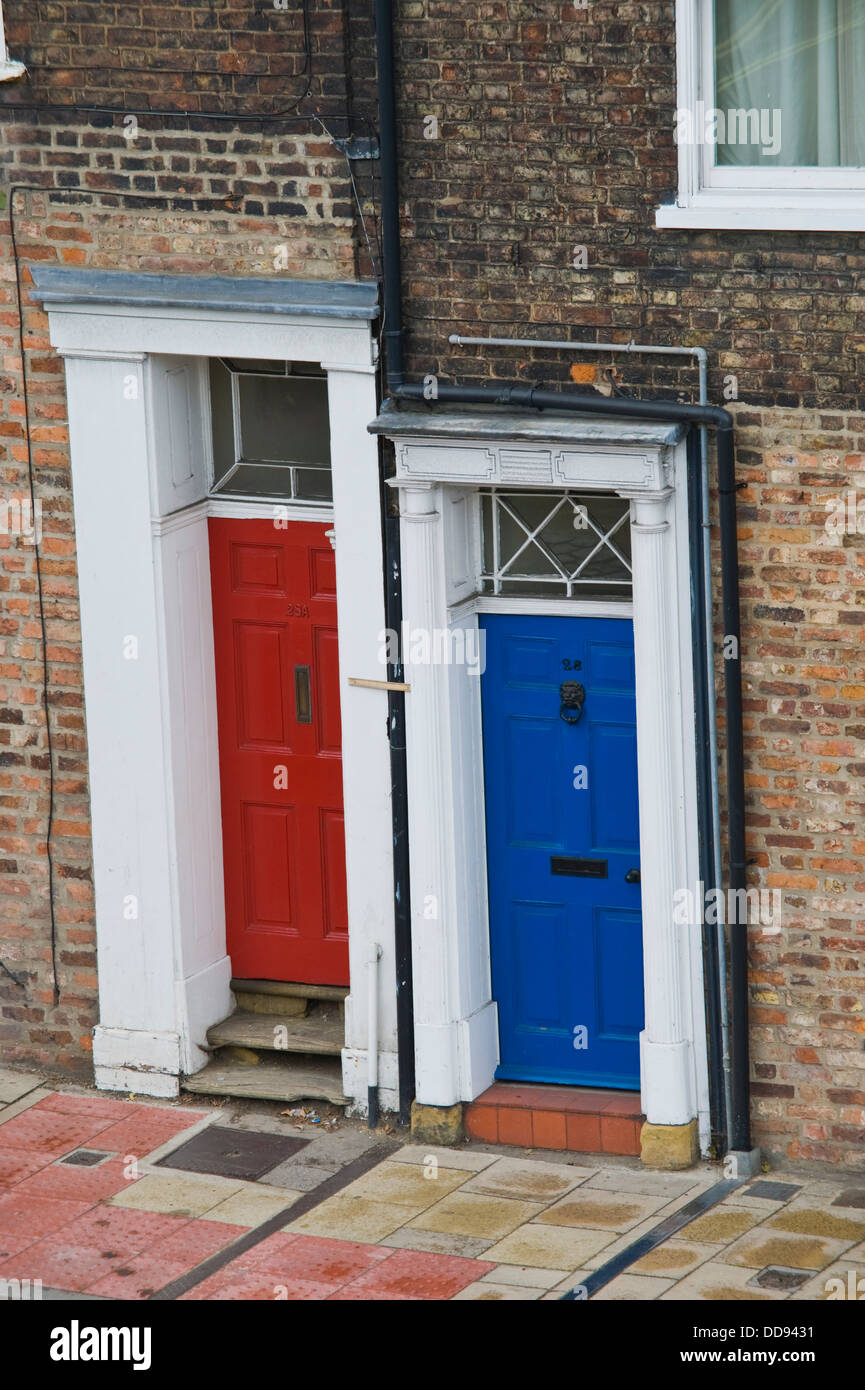 Red And Blue Front Doors Of Terraced Houses In City Of York North