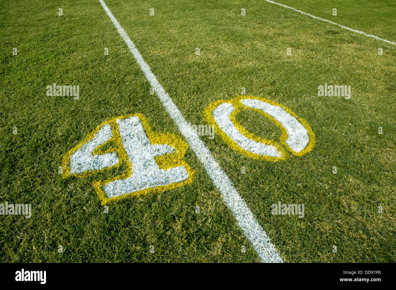 Painted yardage lines of football field, some being painted 40 Stock