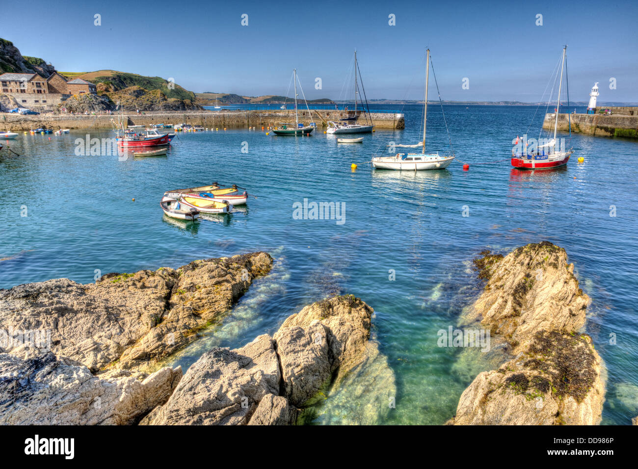 Boats and yachts in harbour Mevagissey Cornwall blue sea and sky in HDR Stock Photo