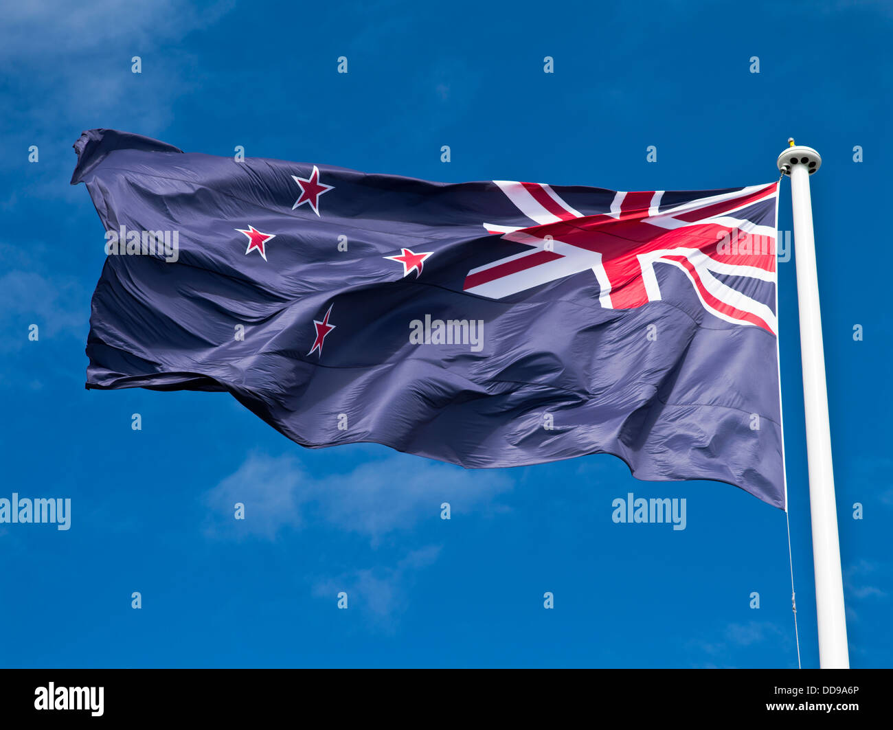 dh FLAG NEW ZEALAND National flag flying white flagpole nz Stock Photo