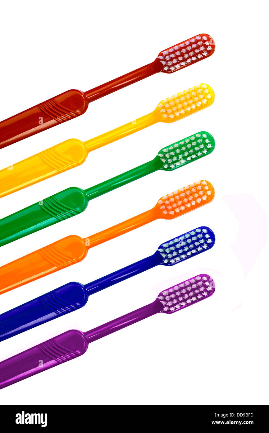 Detail of a row of different coloured toothbrushes great border or frame for dentists practice Stock Photo