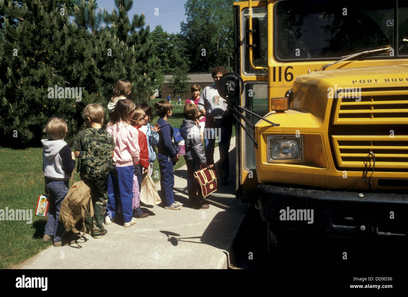 Students board school bus for transportation to school and home Stock ...
