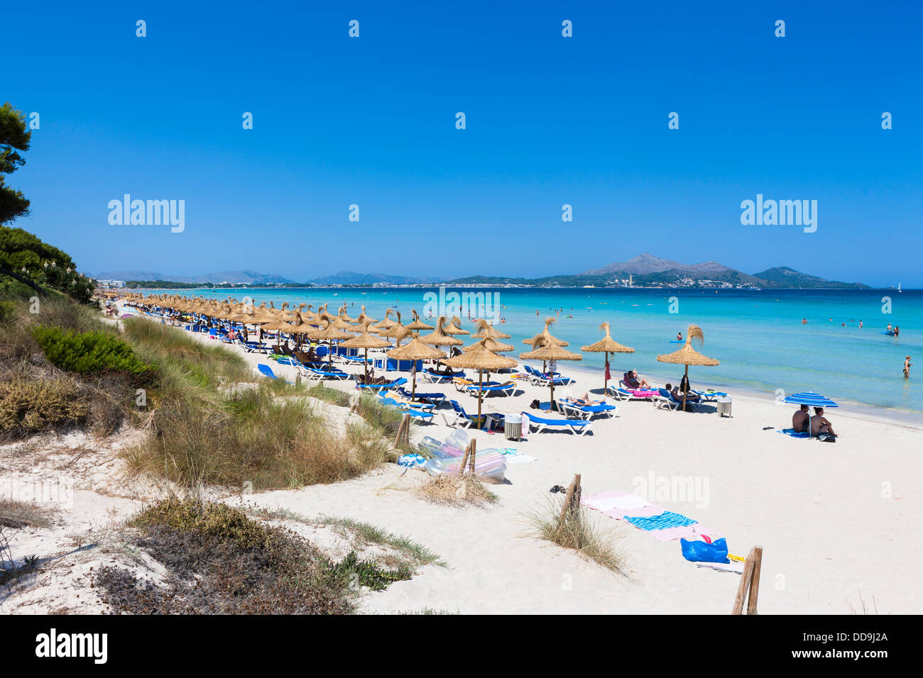 Spain, Mallorca, View of tourists in Playa de Muro beach Stock Photo