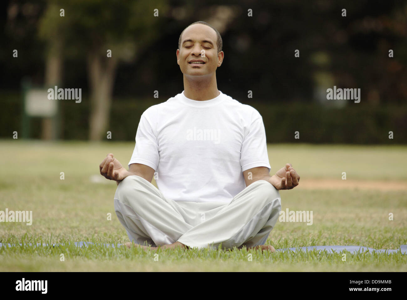 Man meditating in lotus Stock Photo - Alamy