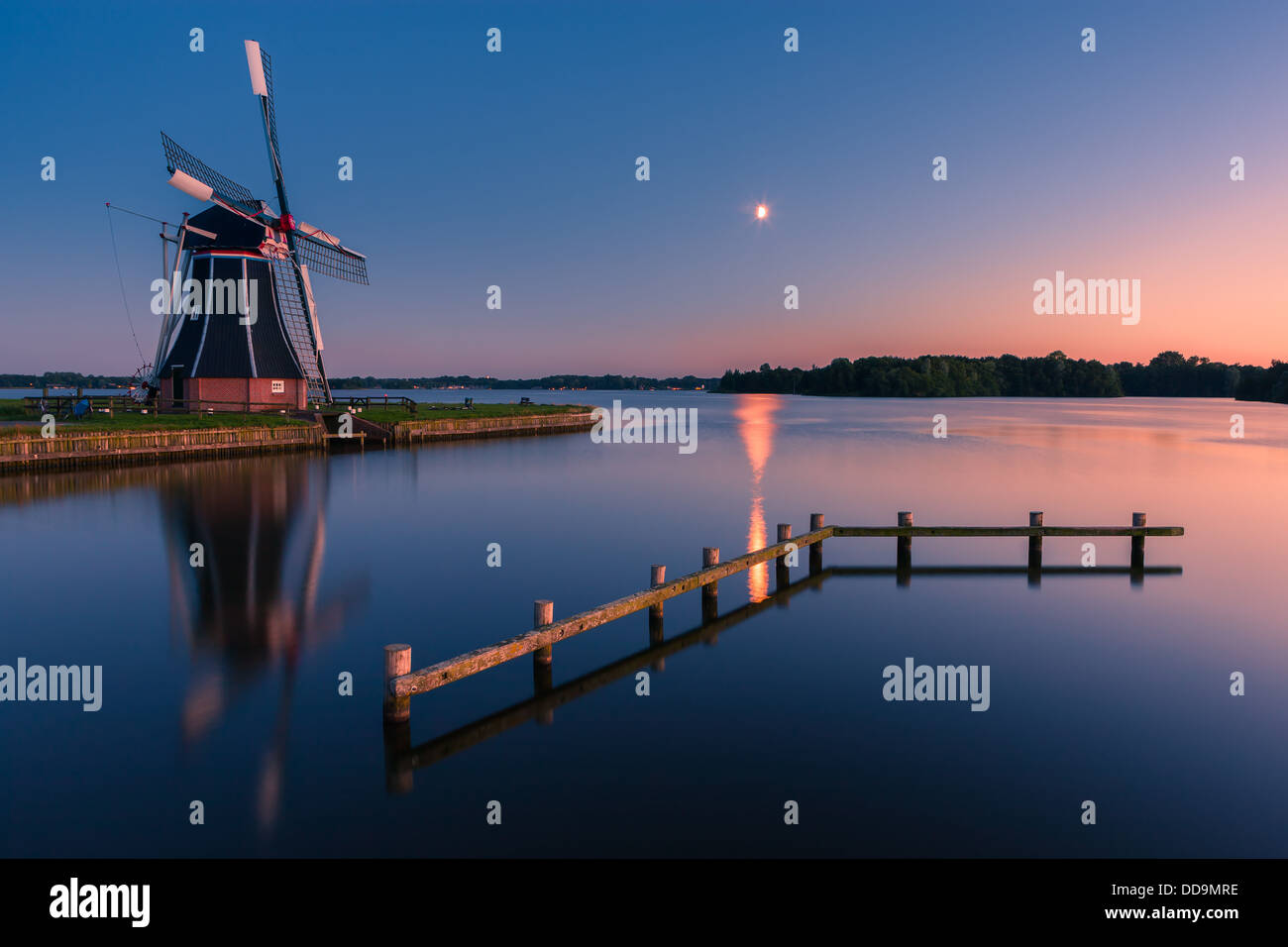 Windmill De Helper at Paterswoldsemeer just after sunset, near Haren in the Province of Groningen, Netherlands Stock Photo