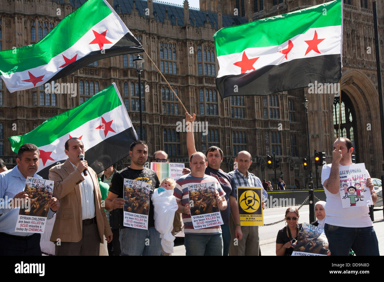 London, UK. 29th Aug, 2013.  Protest outside parliament by UK-based Syrians demanding action against the Assad regime for chemical weapons attacks aginst civilians. Credit:  Paul Davey/Alamy Live News Stock Photo