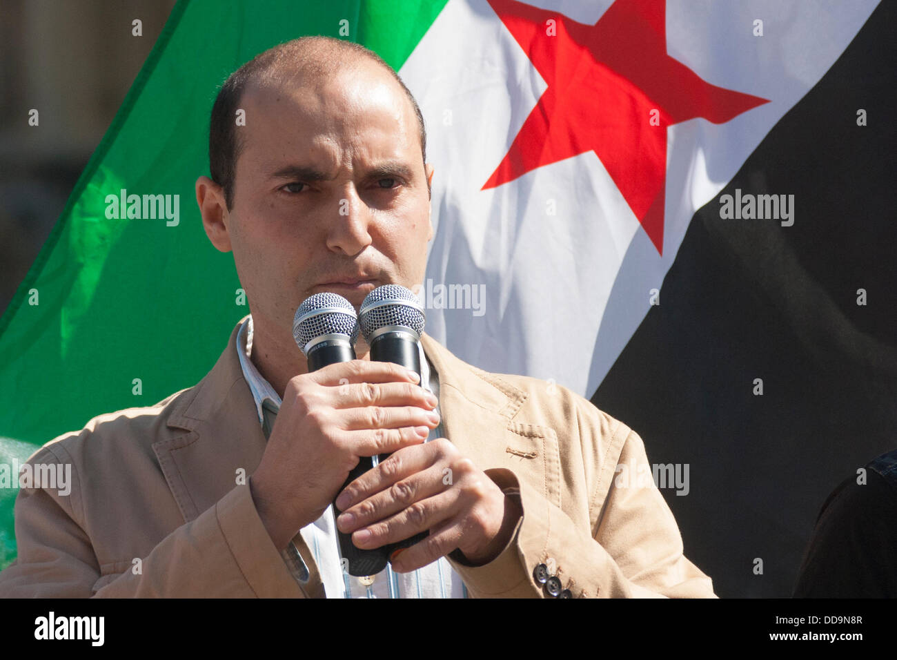 London, UK. 29th Aug, 2013. An activist addresses the gathering at a protest outside parliament by UK-based Syrians demanding action against the Assad regime for chemical weapons attacks aginst civilians. Credit: Paul Davey/Alamy Live News Stock Photo