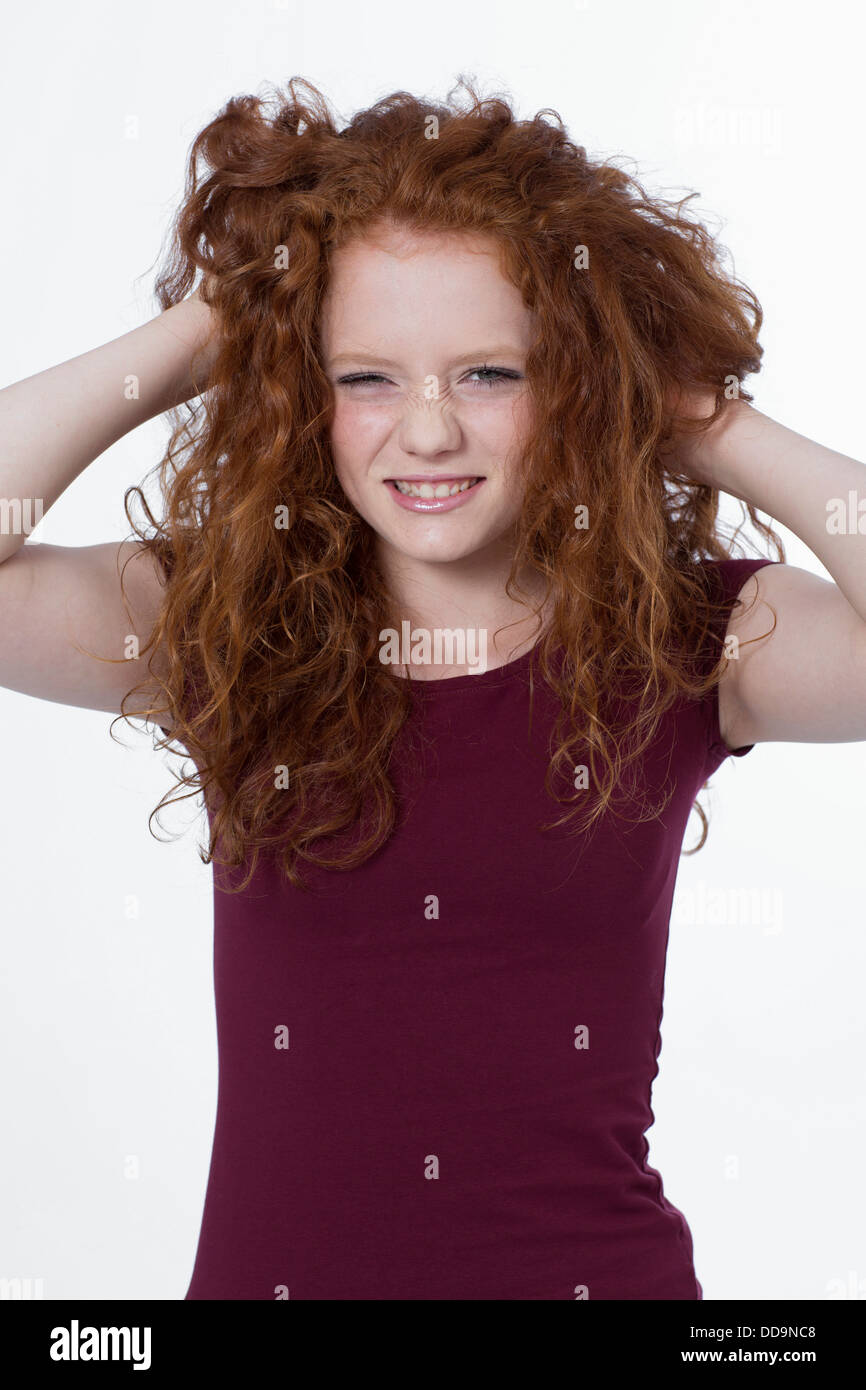 Portrait of girl pulling hair, smiling Stock Photo Alamy