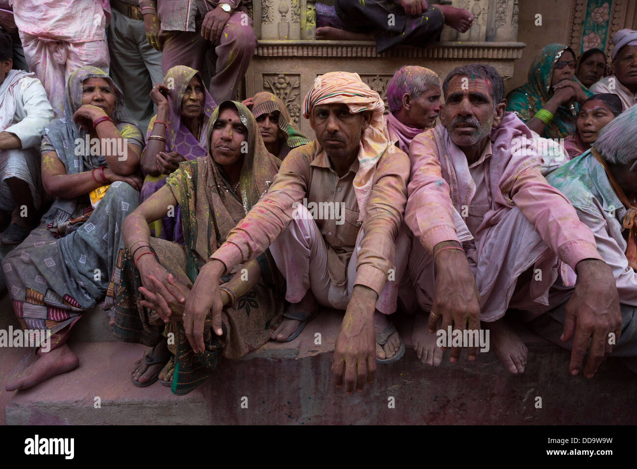 Several spectators waiting in the streets to begin the traditional confrontation between women and men in the Holi. Stock Photo