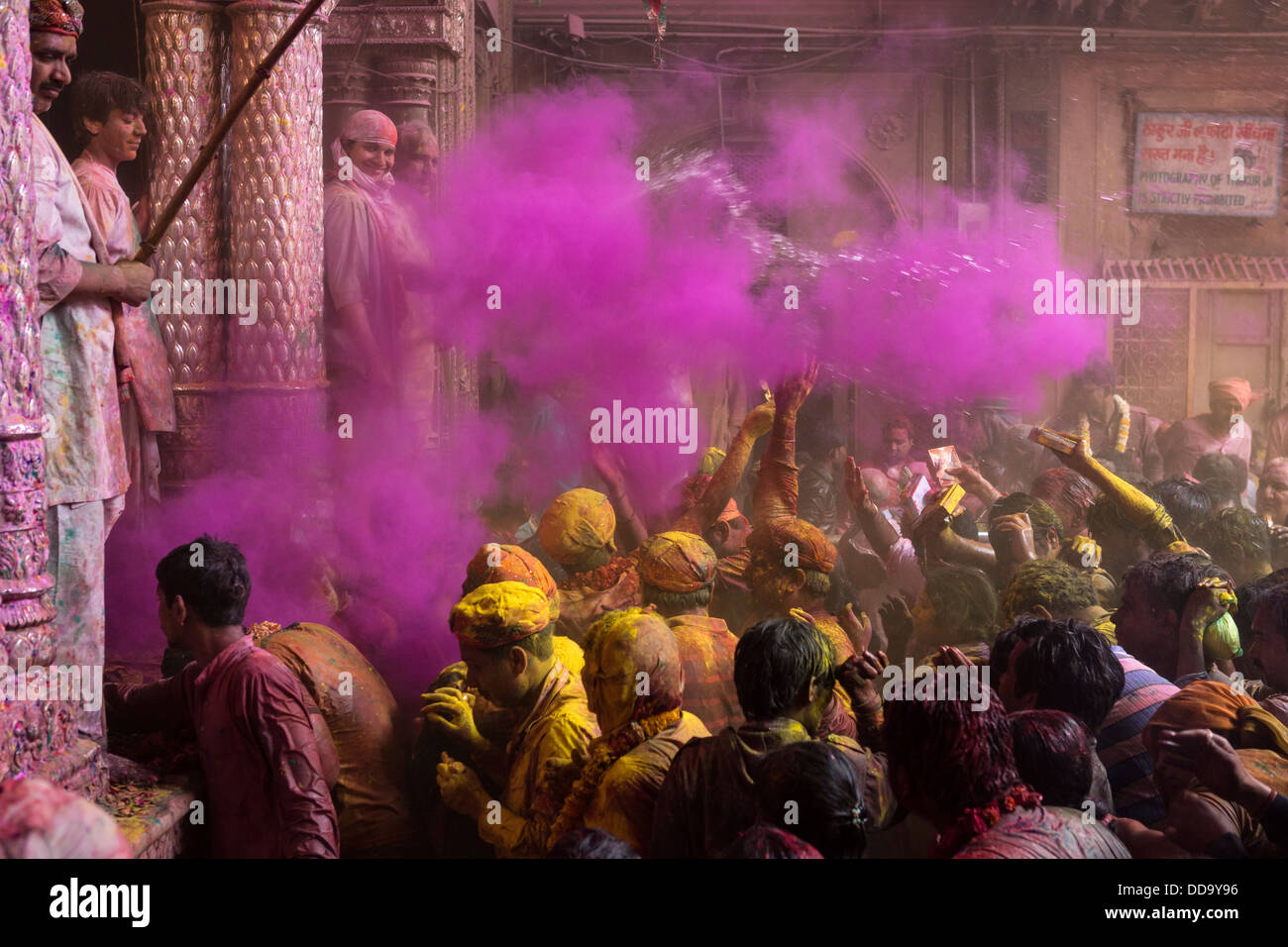 A large number of believers praying in front the image of Krishna inside the temple during the festival of Holi in Vrindavan Stock Photo