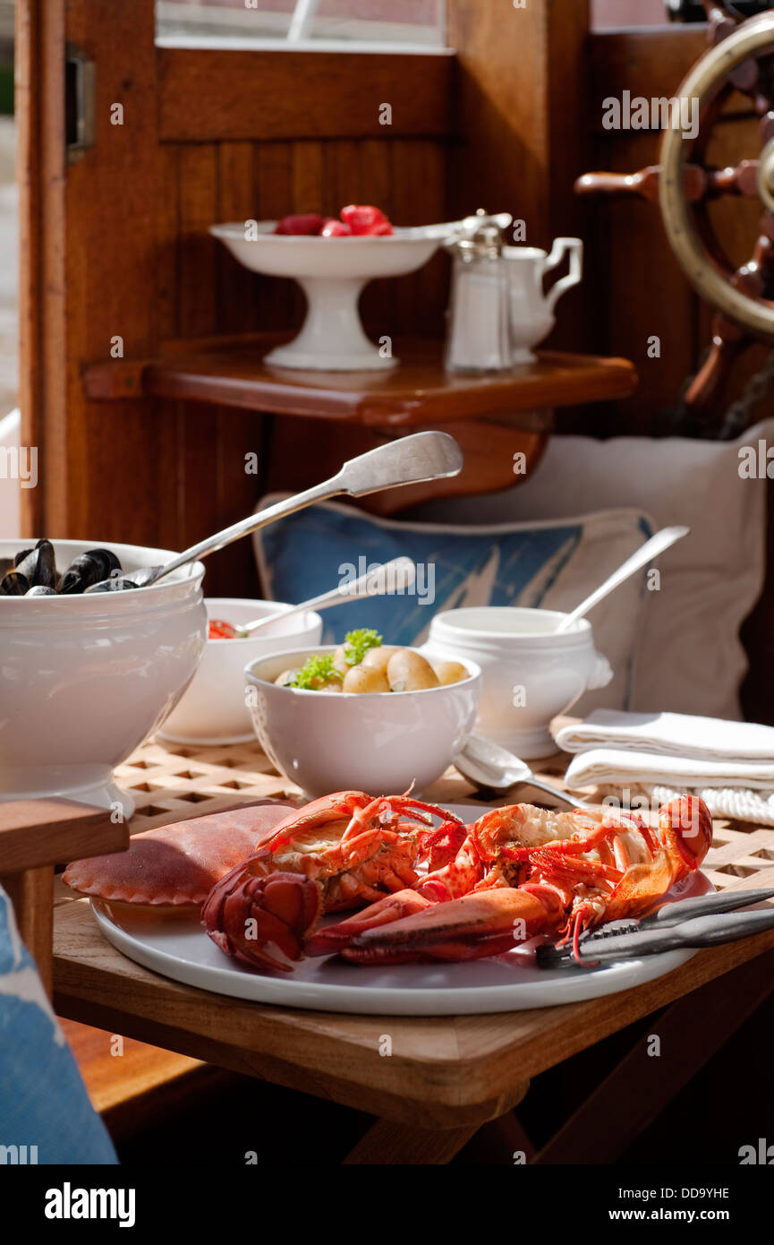 Seafood lunch in cabin interior Stock Photo