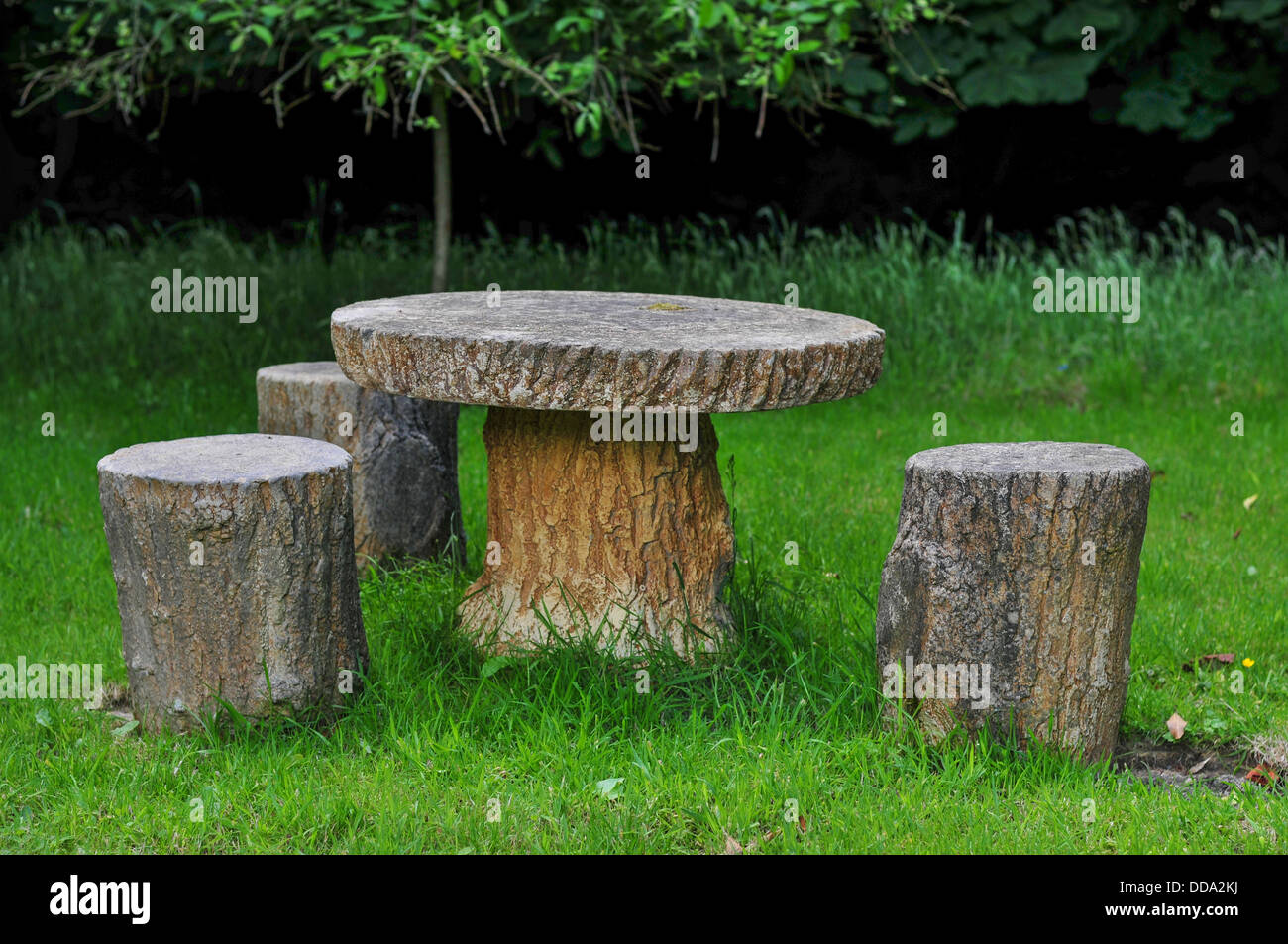 Wooden Seating in a Garden During Summer Stock Photo
