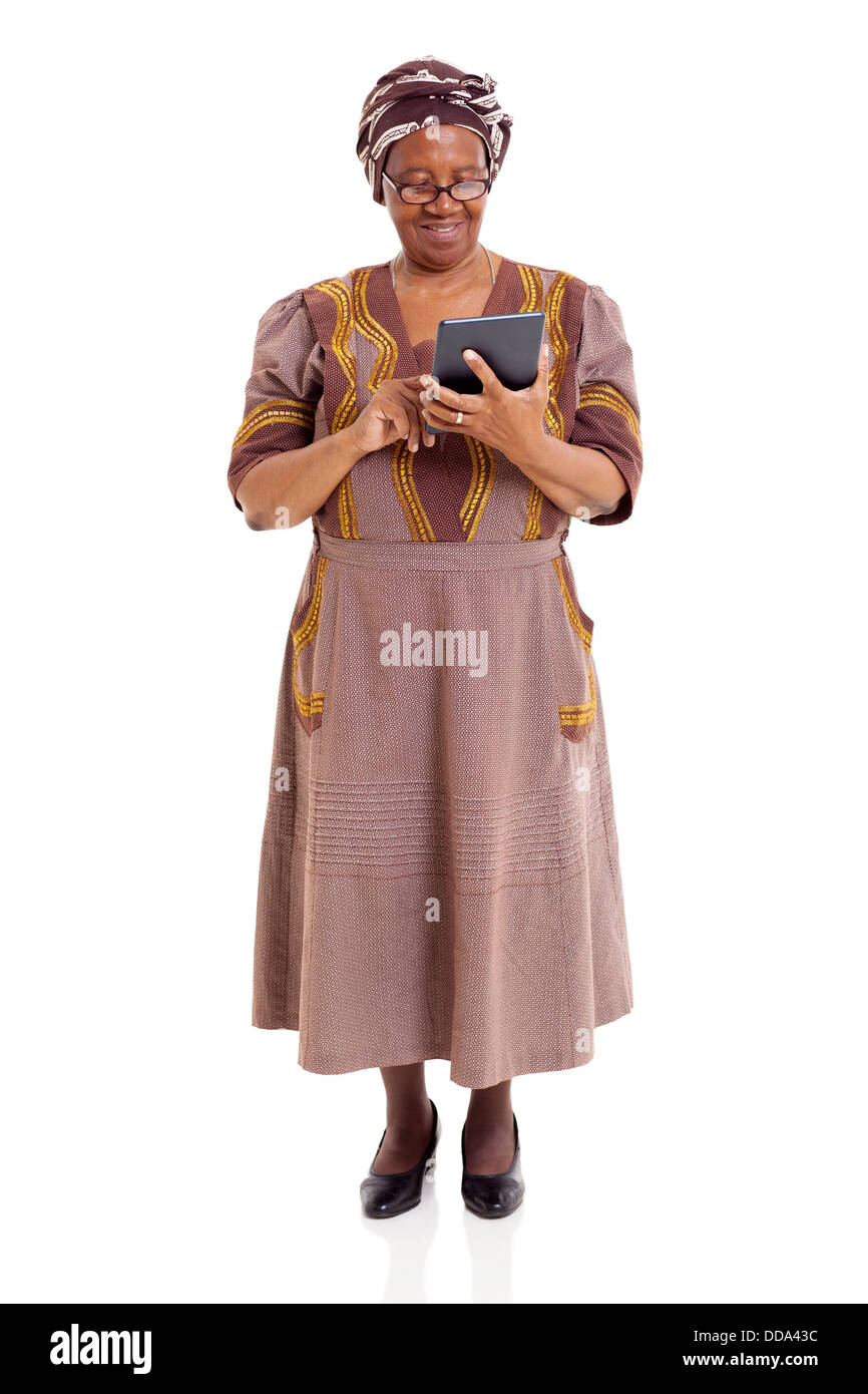 senior African woman using tablet computer isolated on white background Stock Photo