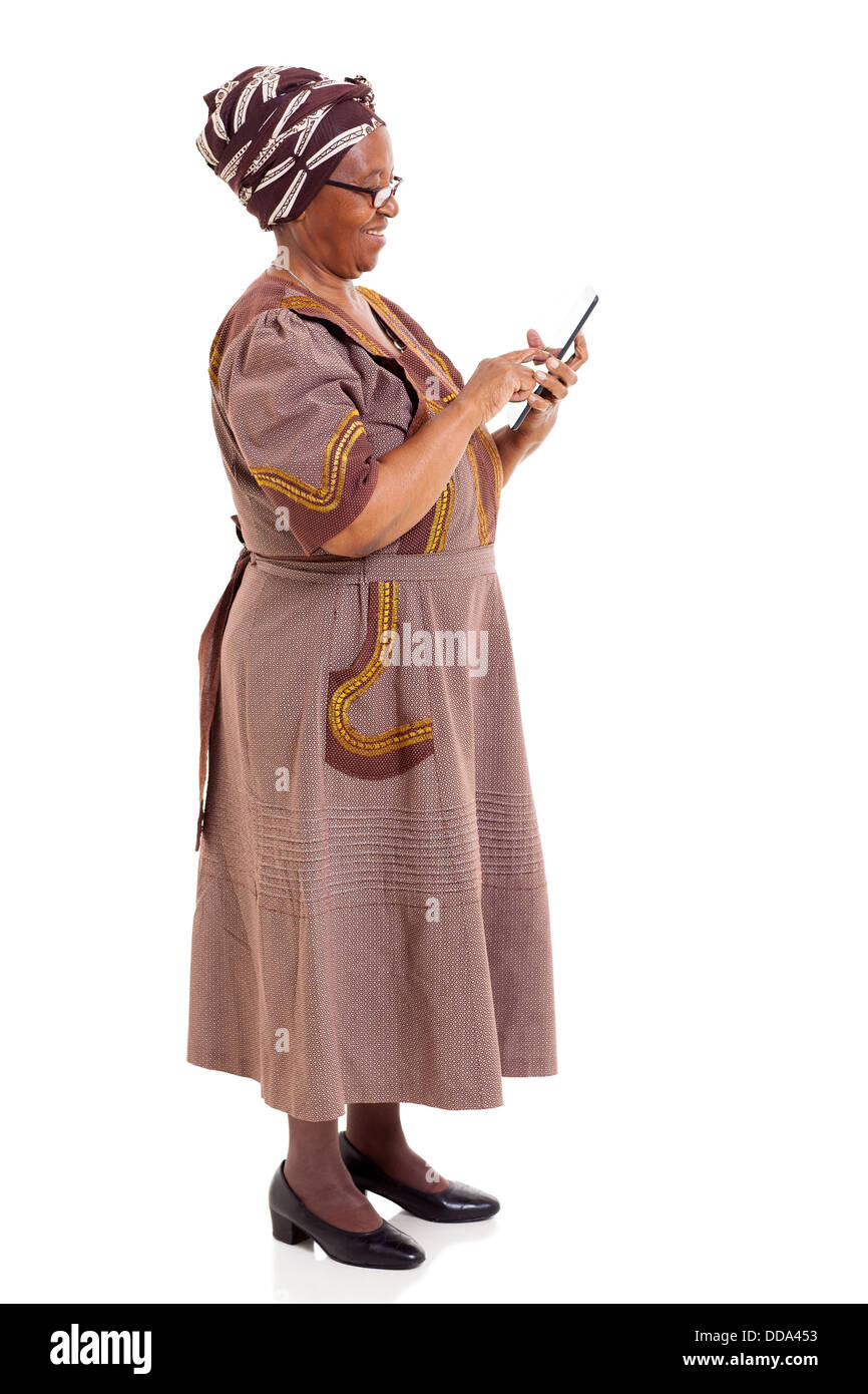 side view of African woman using tablet computer on white background Stock Photo