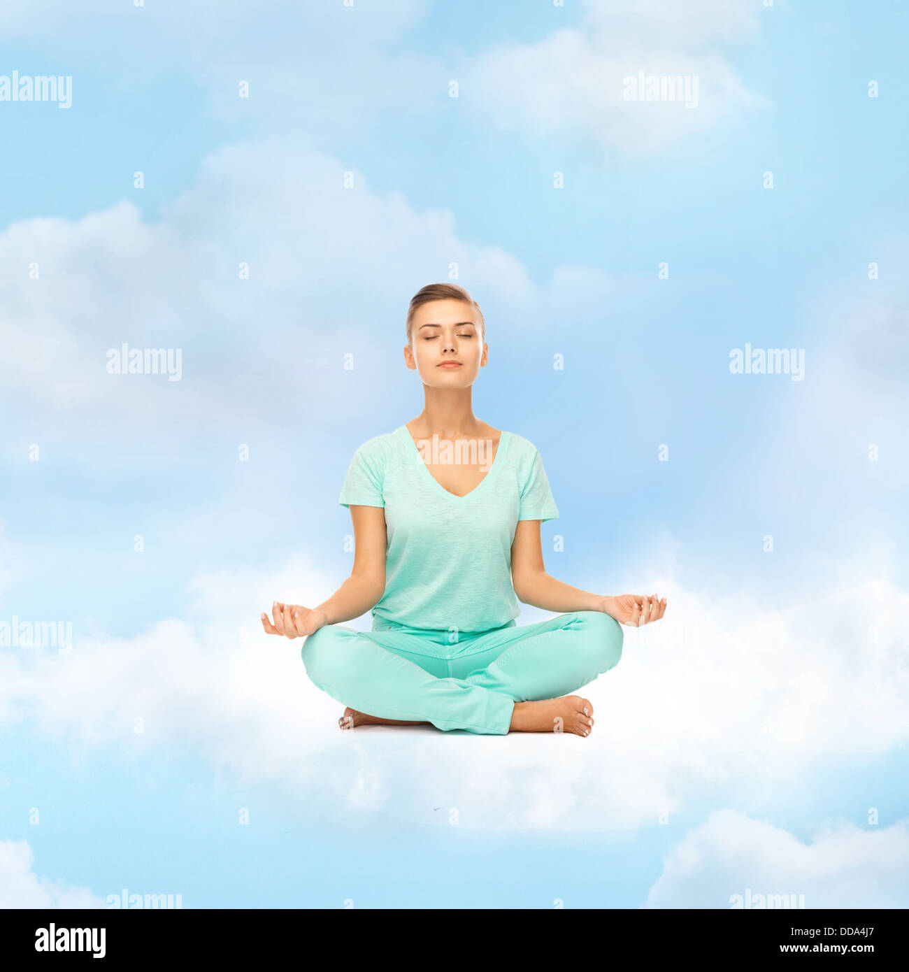 girl sitting in lotus position and meditating Stock Photo - Alamy