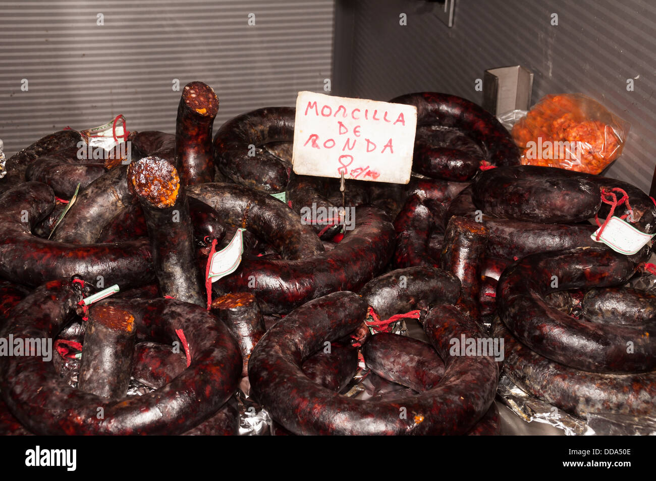 Black pudding for sale in a indoor market in Malaga Stock Photo