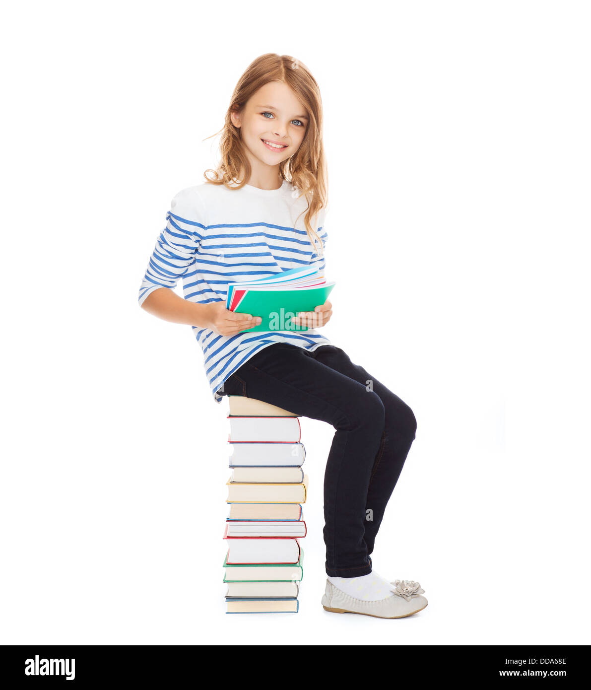 little student girl sitting on stack of books Stock Photo - Alamy