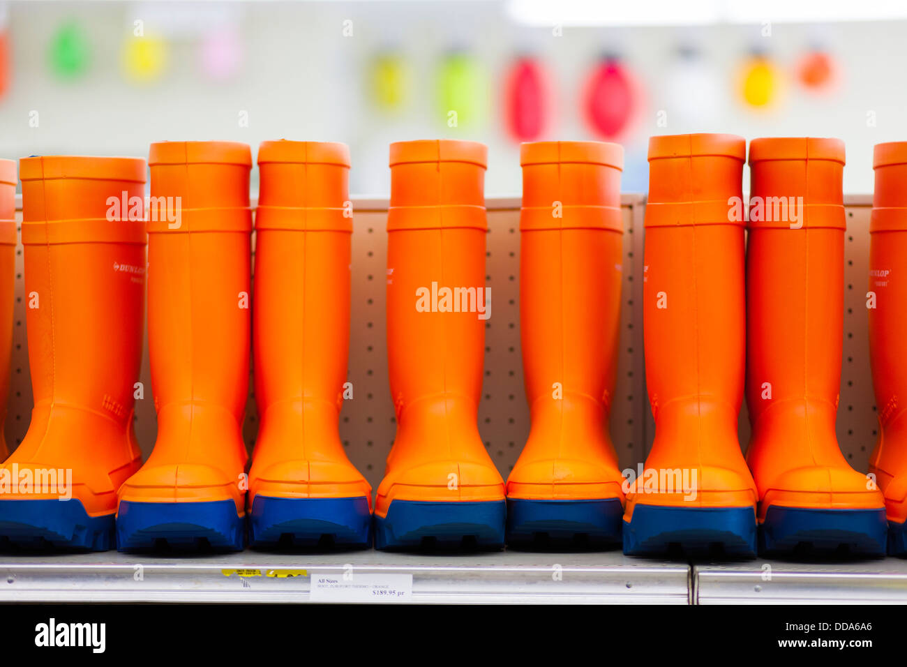 Bright insulated rubber boots for sale in a fishermans supply store or