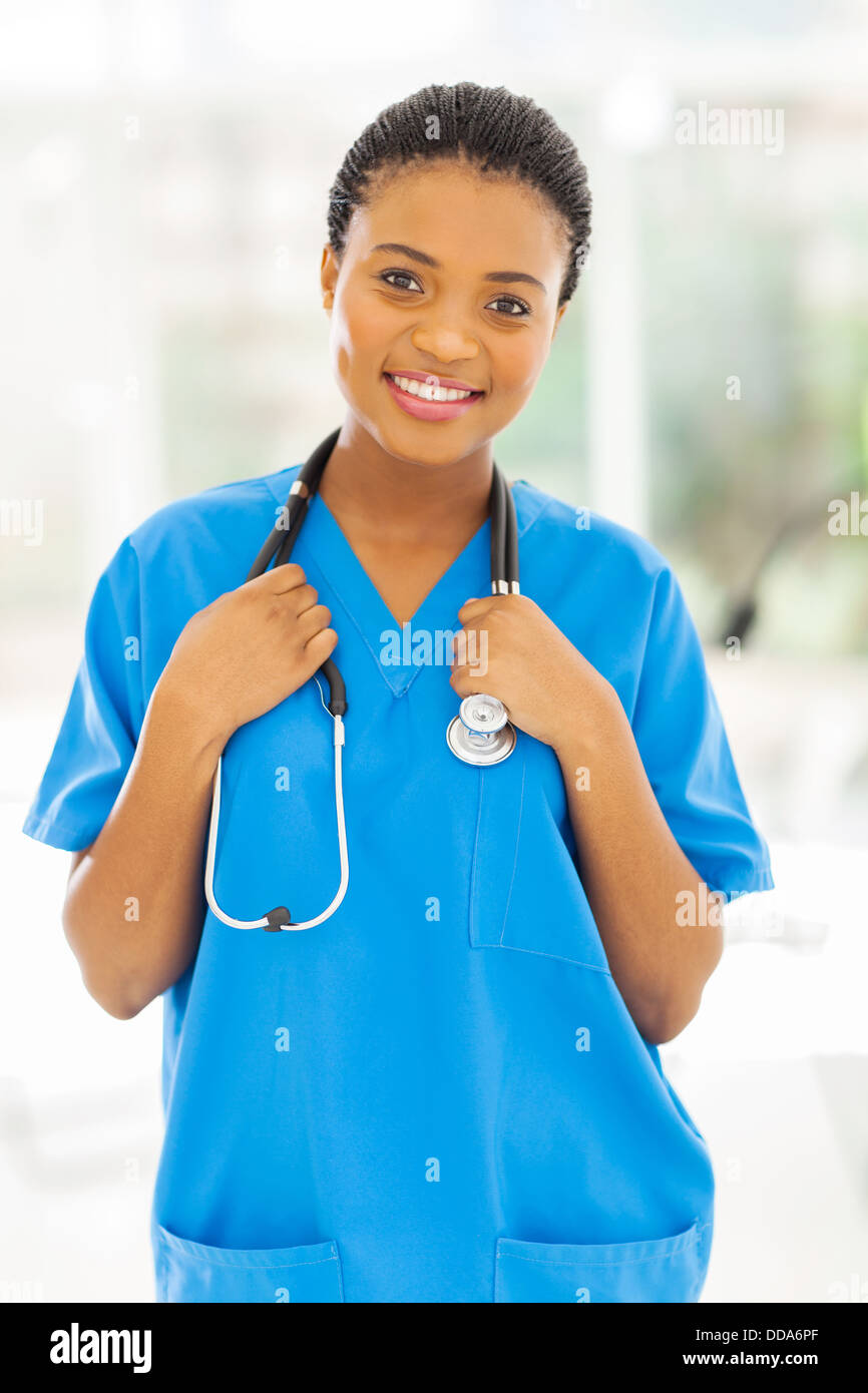 beautiful young African female nurse in office Stock Photo