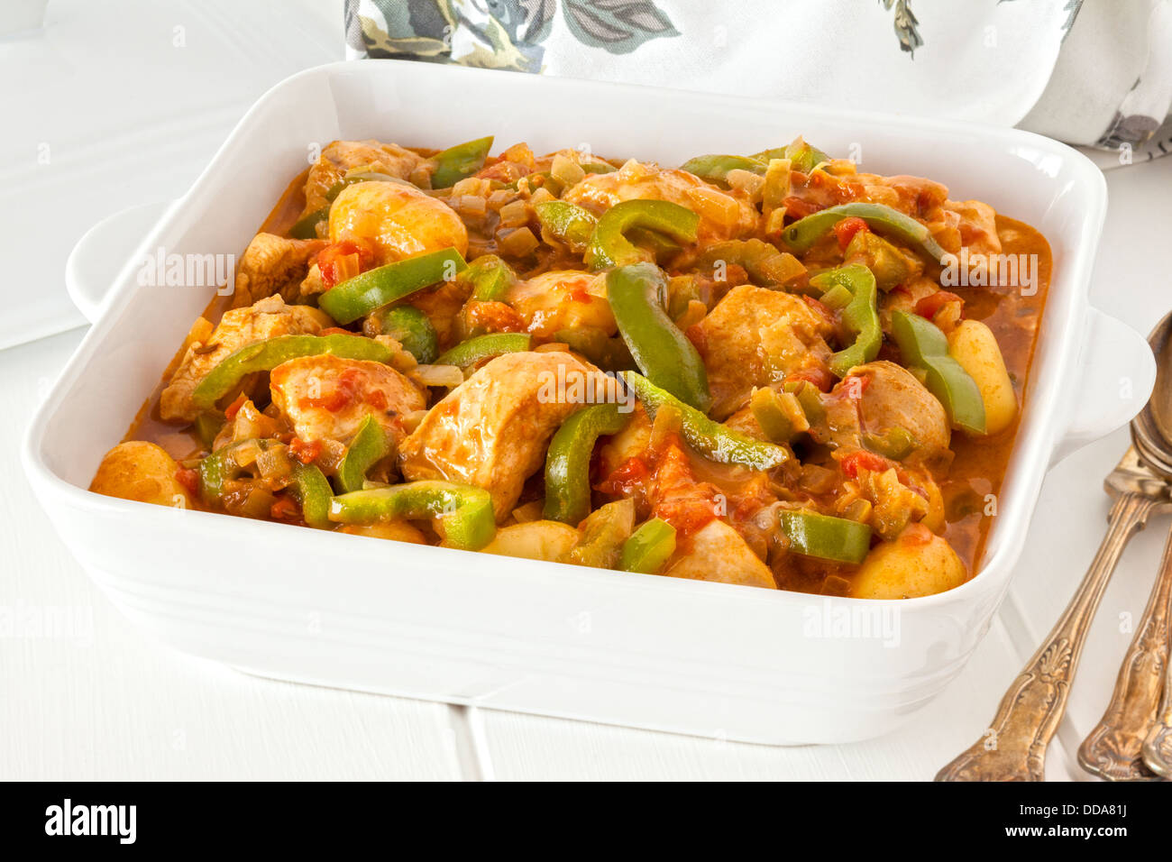 Chicken stew or goulash - chicken breast cooked with onions, paprika, potatoes and green peppers, in a creamy tomato sauce. Stock Photo