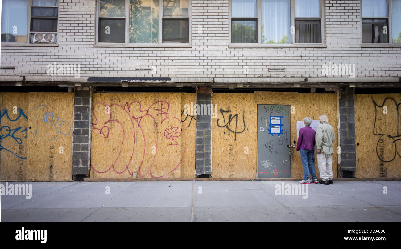Plywood hides the renovation of a storefront in Greenwich Village in New York on Tuesday, August 27, 2013. (© Richard B. Levine) Stock Photo