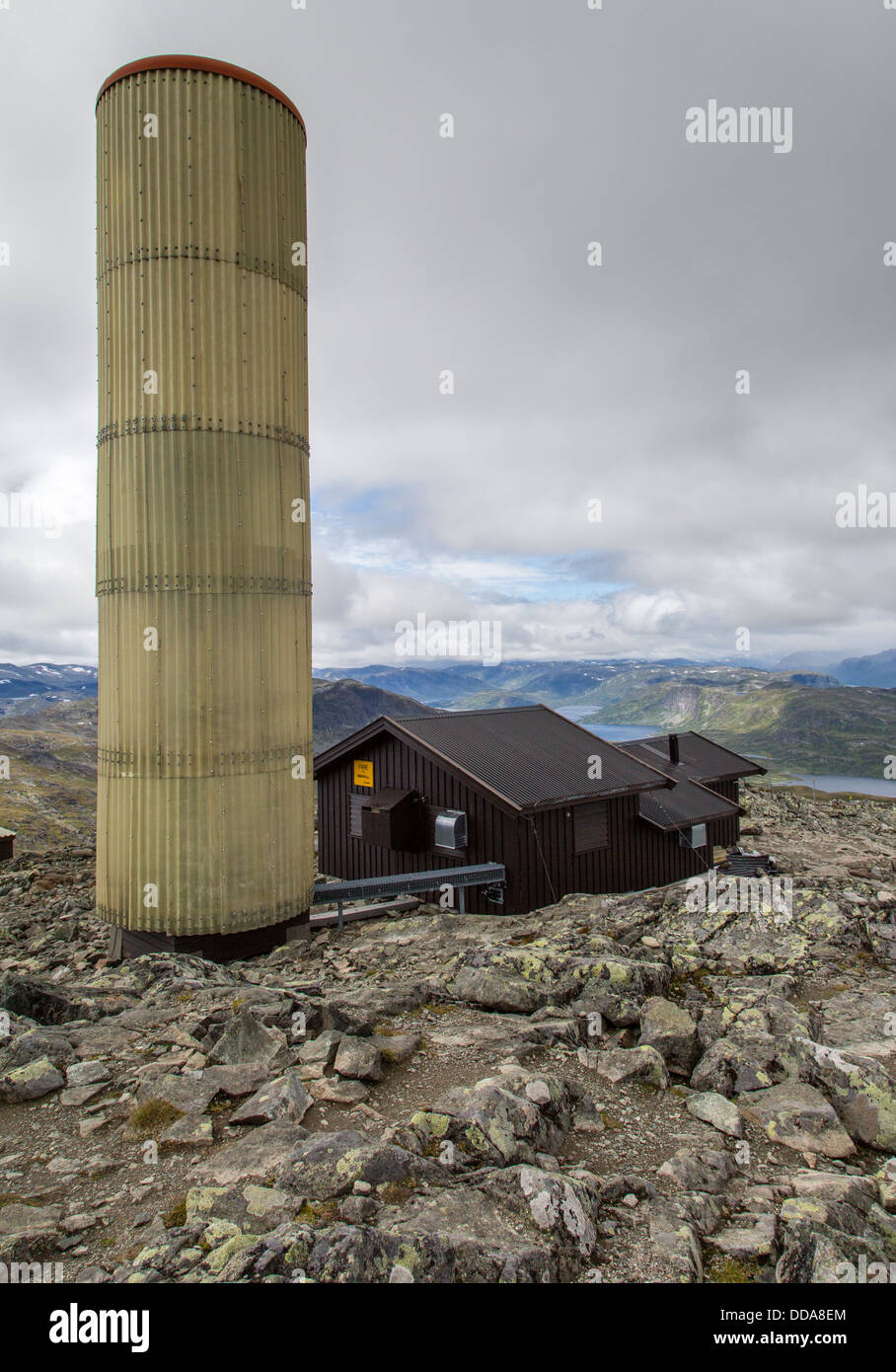 Telecomms mast on the summit of Bitihorn in the Jotunheimen National Park in Norway disguised and protected by corrugated cover Stock Photo