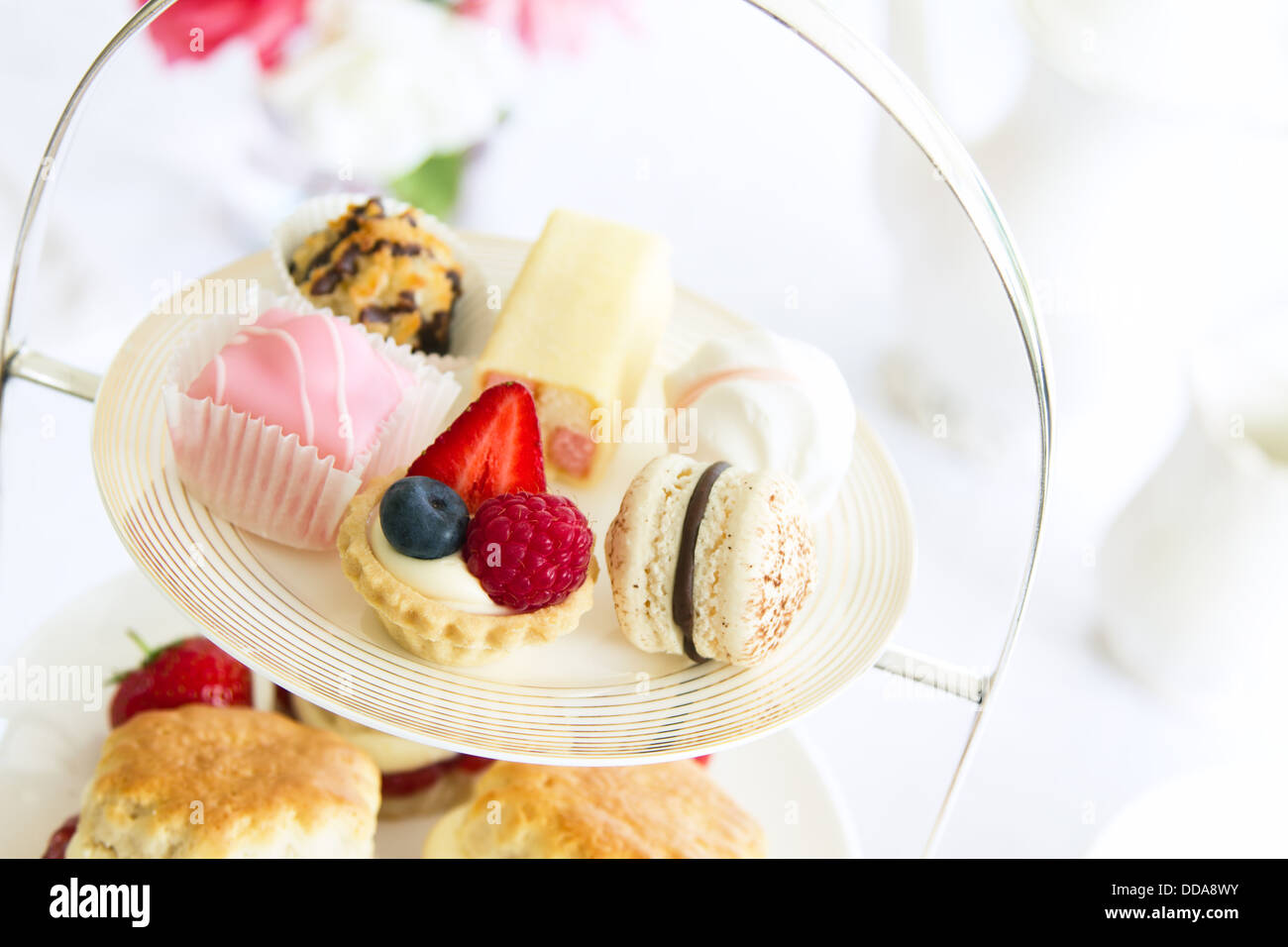 Afternoon tea served with an assortment of cakes Stock Photo