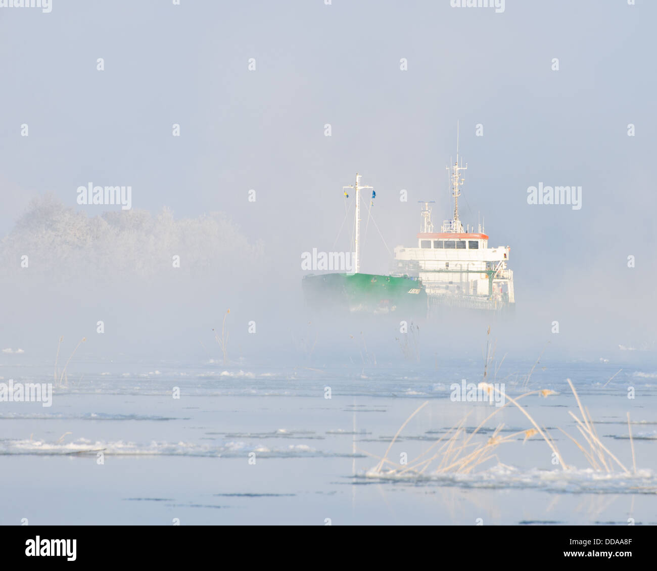 Ship on river in winter, Göta Älv, Sweden Stock Photo