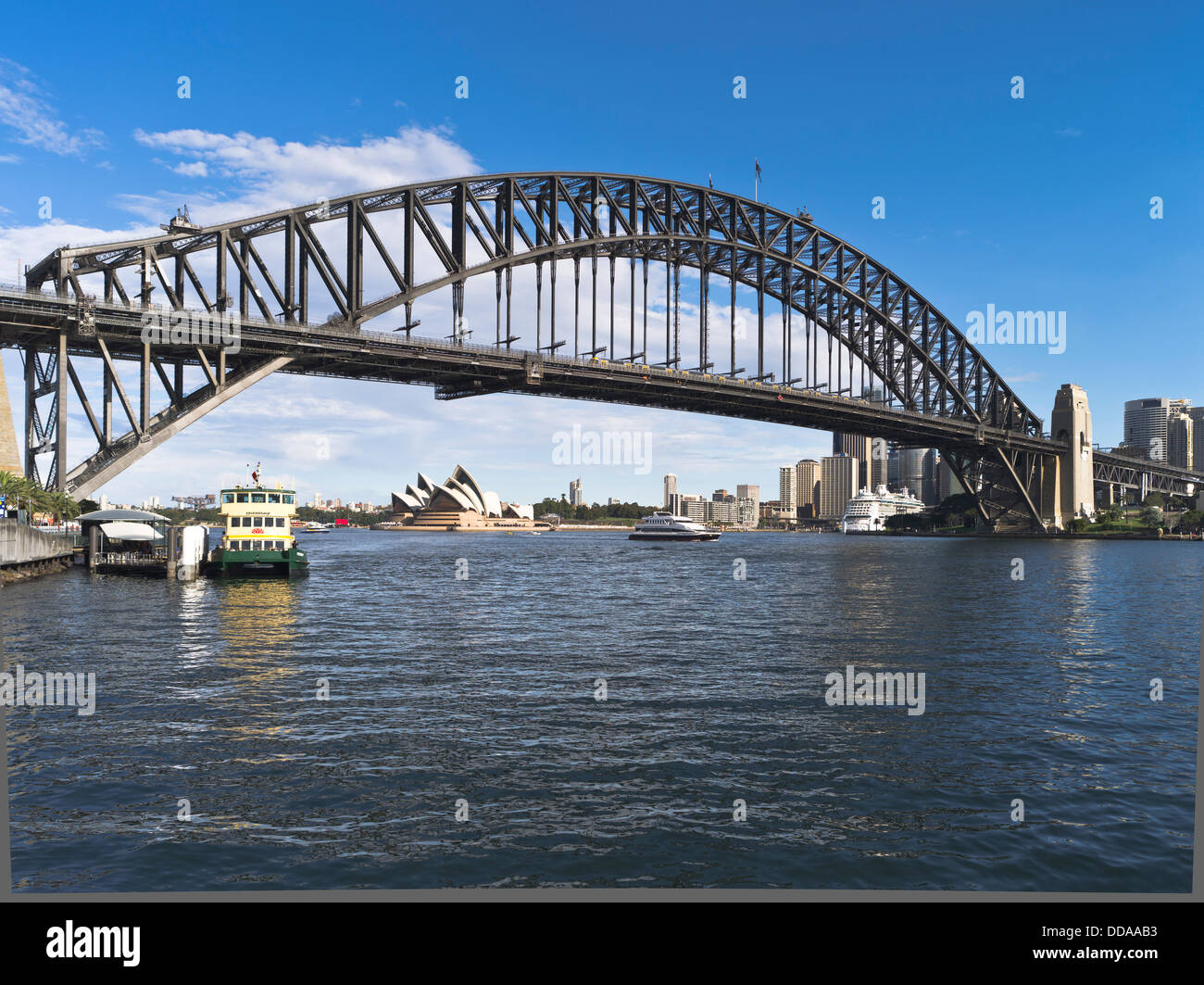 dh Sydney Harbour Bridge SYDNEY AUSTRALIA Sydney Opera House city skyscraper skyline ferries Milsons Point wharf Stock Photo