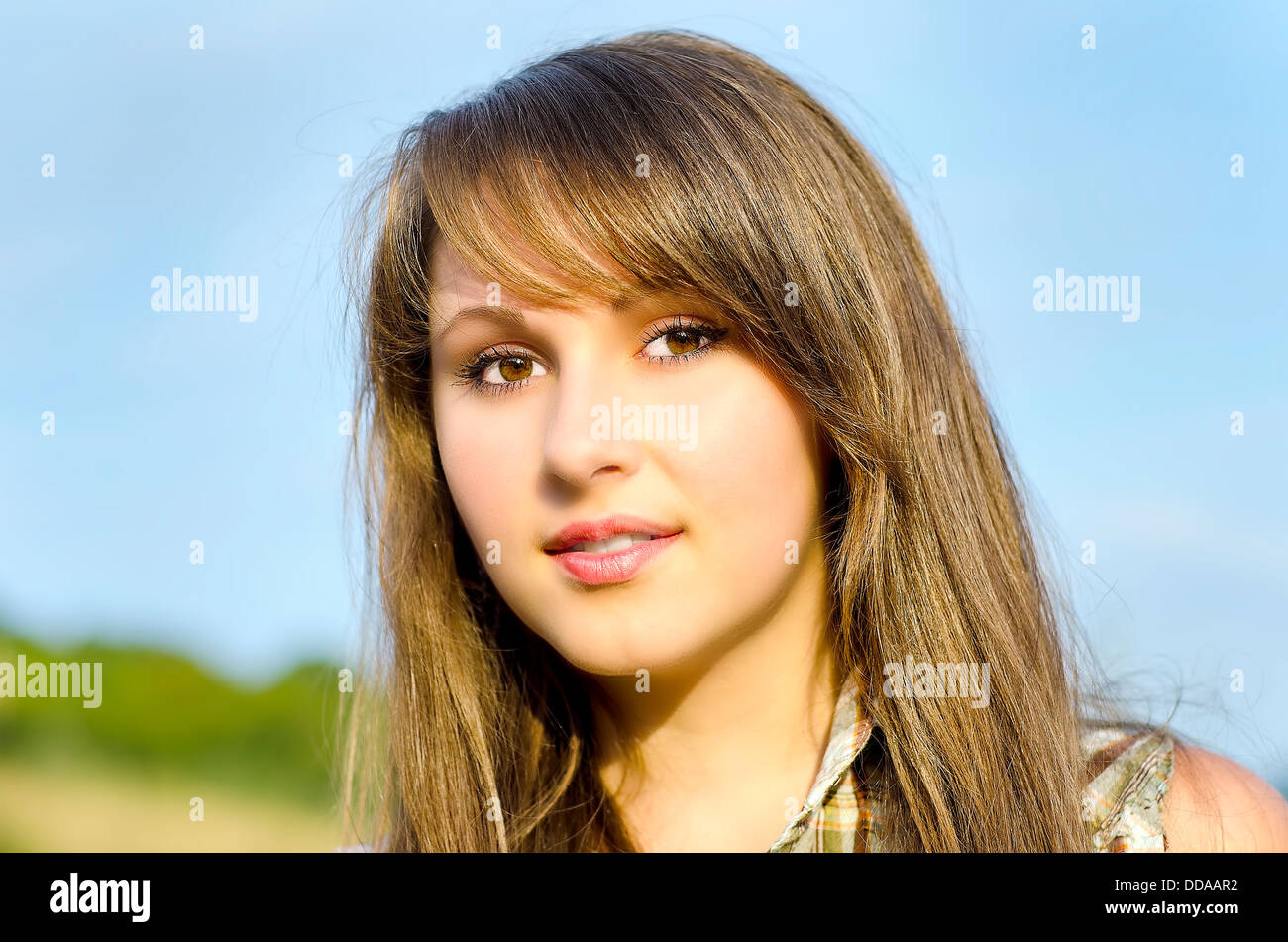 Portrait of a beautiful girl in the summer garden Stock Photo - Alamy