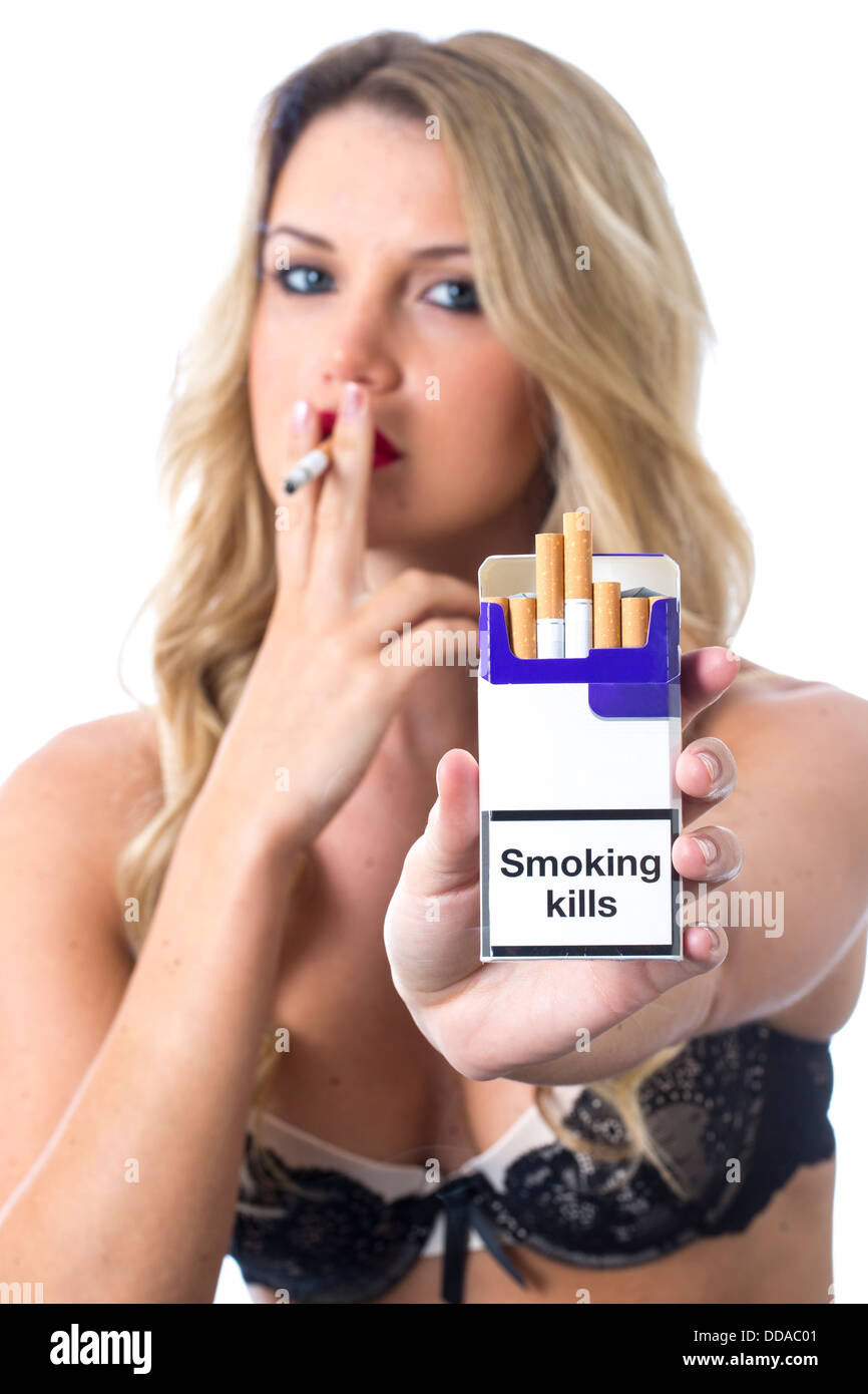 Woman with a pack of cigarettes hi-res stock photography and images