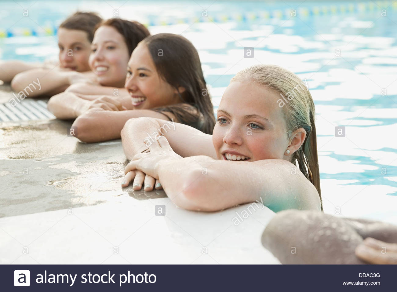Group of teenagers in swimming pool Stock Photo