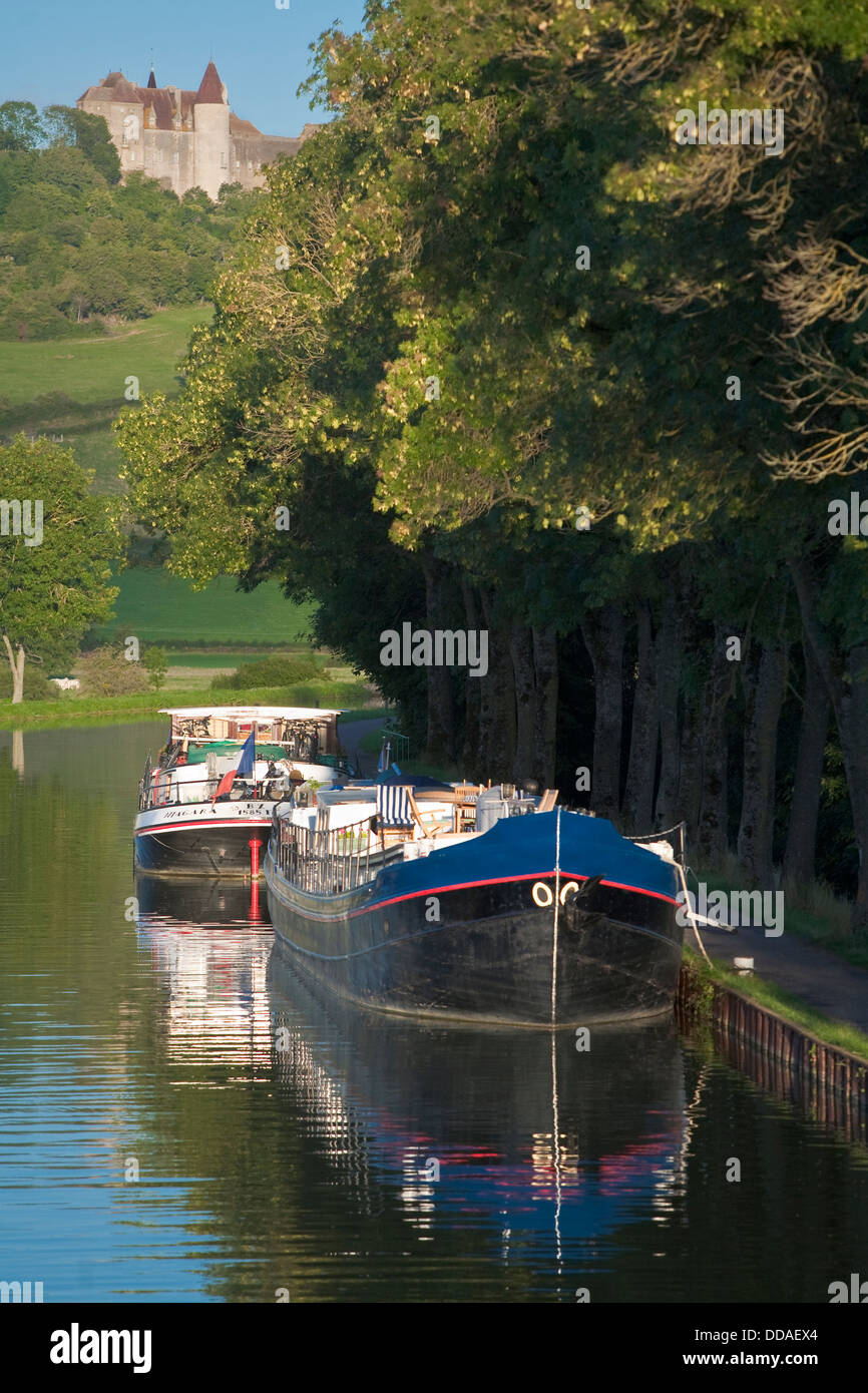Barges tied to bank of Burgundy Canal, Chateauneuf en Auxois, Cote d'Or, Burgundy, France Stock Photo