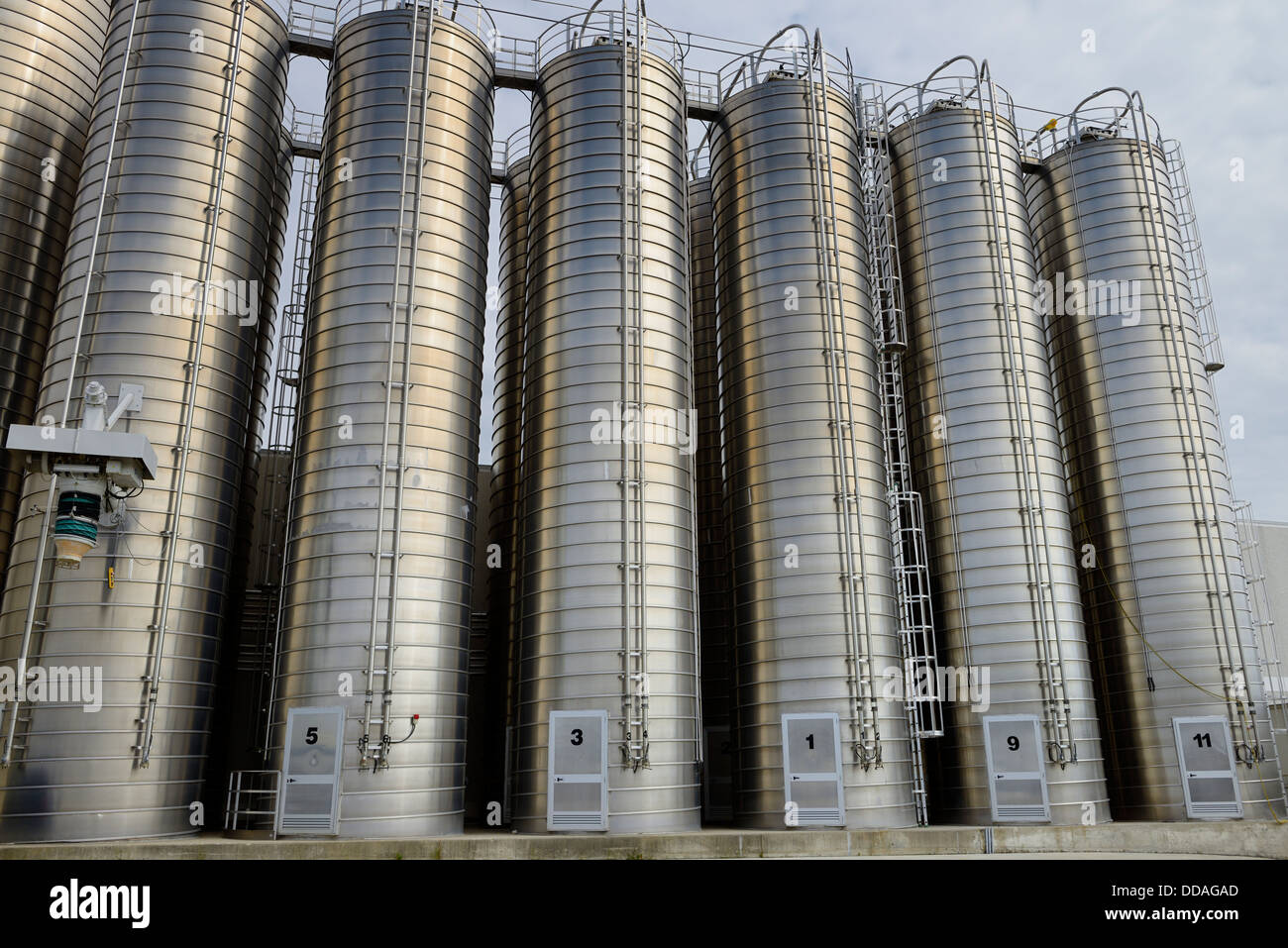 Large stainless steel tanks containing plastic ingredients for extrusion industry Vaughan Canada Stock Photo