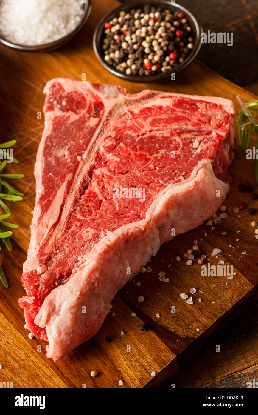 Thick Raw TBone Steak with Seasoning and Rosemary Stock Photo Alamy