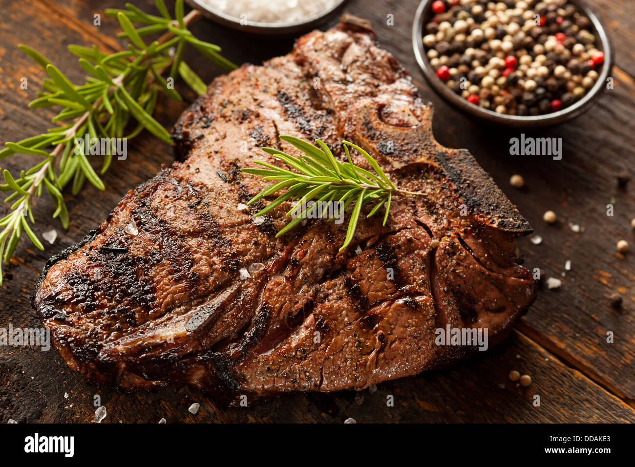 Grilled BBQ T-Bone Steak with Fresh Rosemary Stock Photo