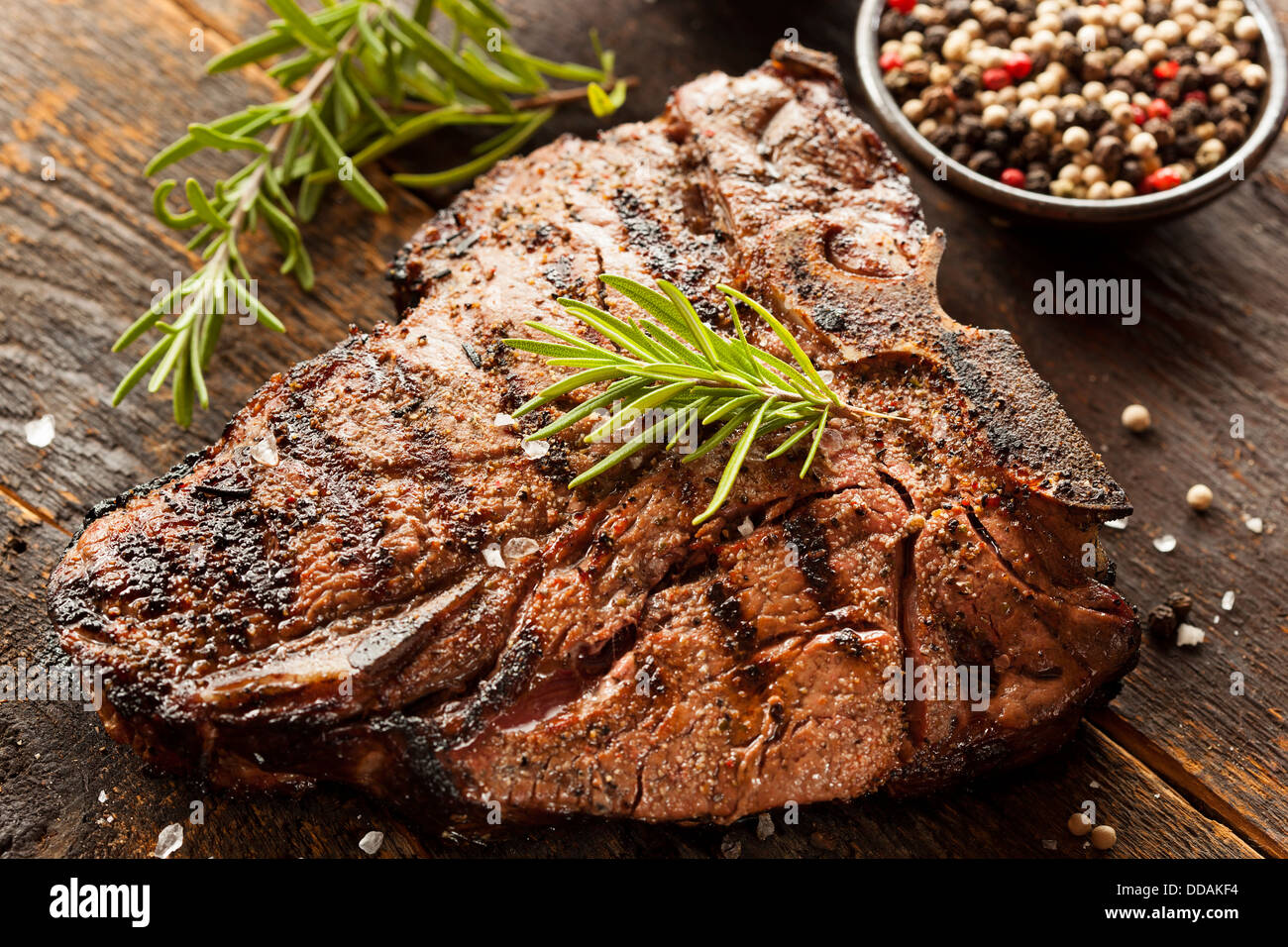 Grilled BBQ T-Bone Steak with Fresh Rosemary Stock Photo