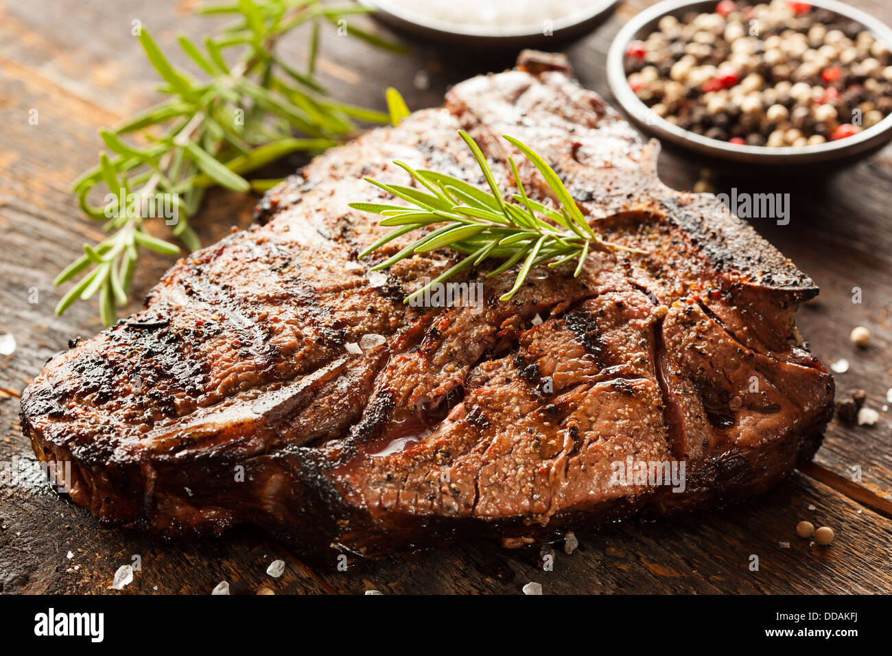 Grilled BBQ T-Bone Steak with Fresh Rosemary Stock Photo