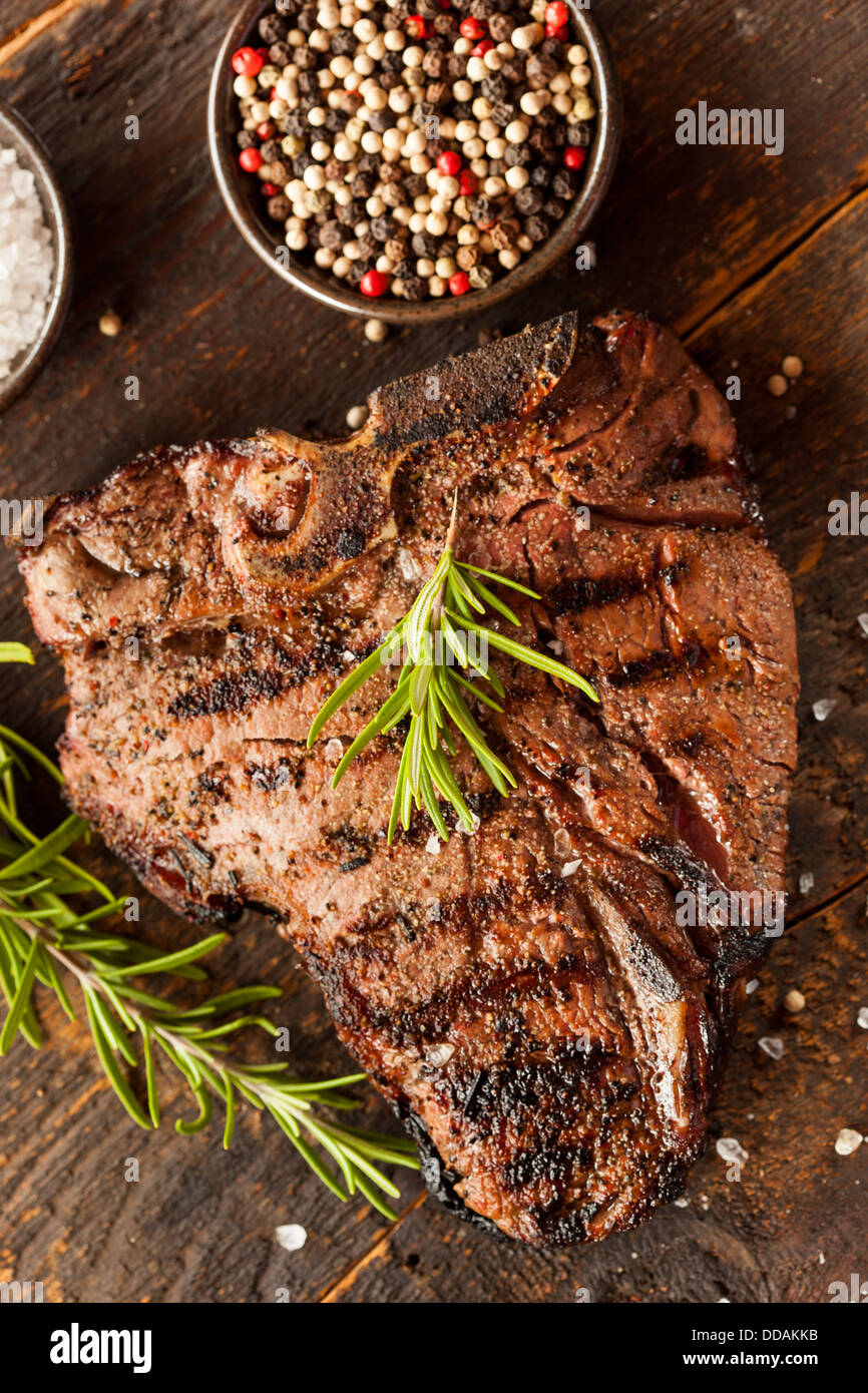 Grilled BBQ T-Bone Steak with Fresh Rosemary Stock Photo