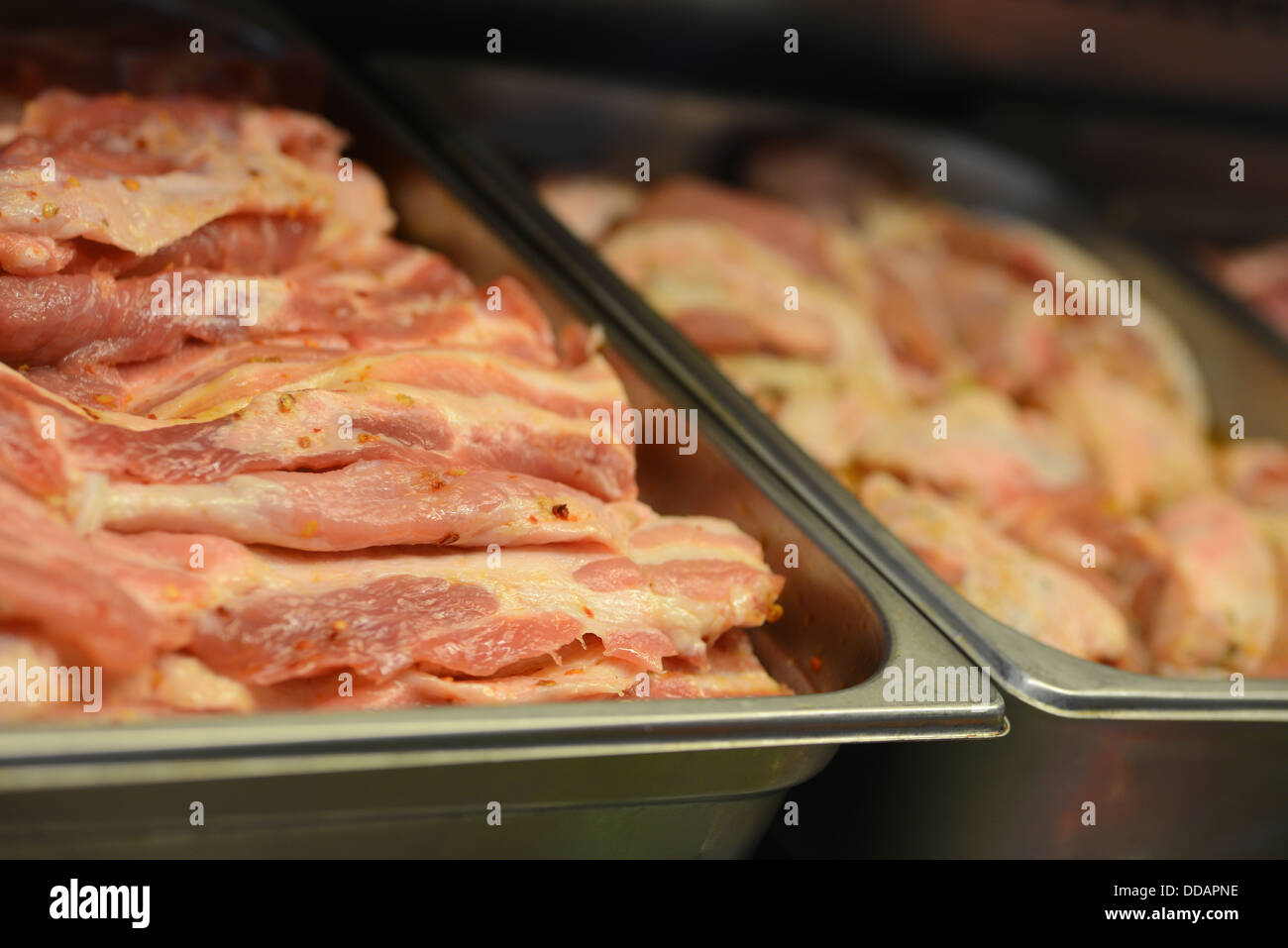 Animal meat products beef cow pork chicken pieces slice portions on diplay Stock Photo